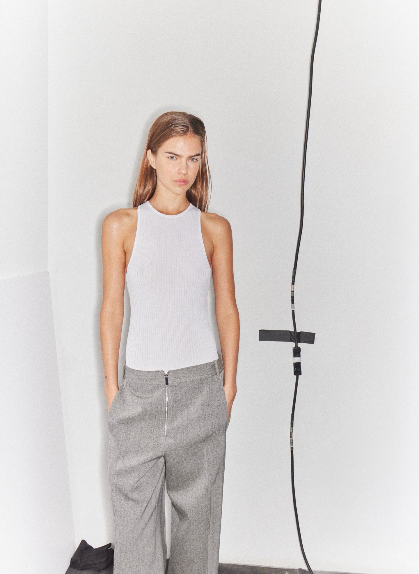 White Ribbed Sweater Cut Out Tank - editorial image on model