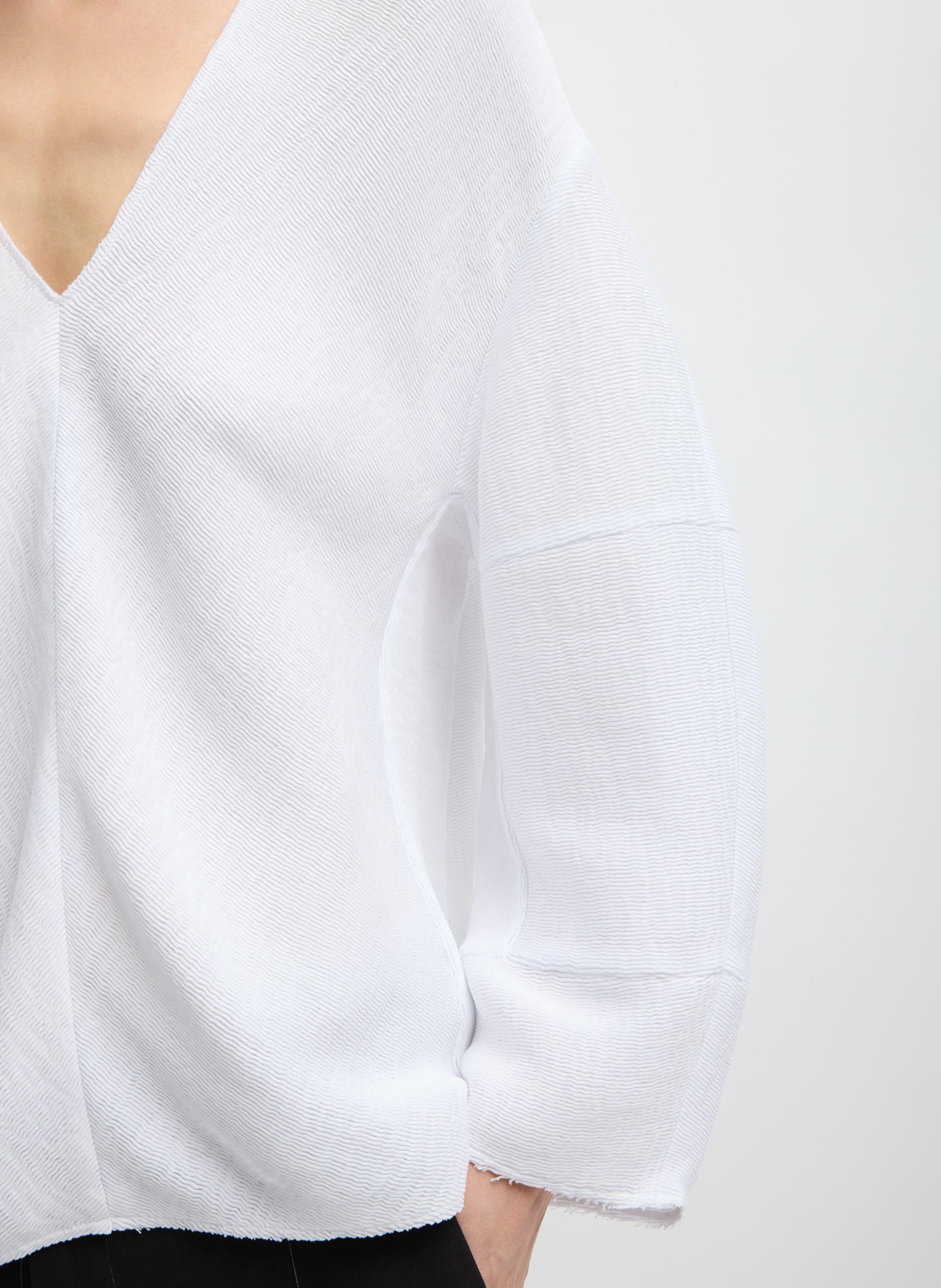 White Viscose Plisse Hinged Long Sleeve Top - closeup of plisse fabrication