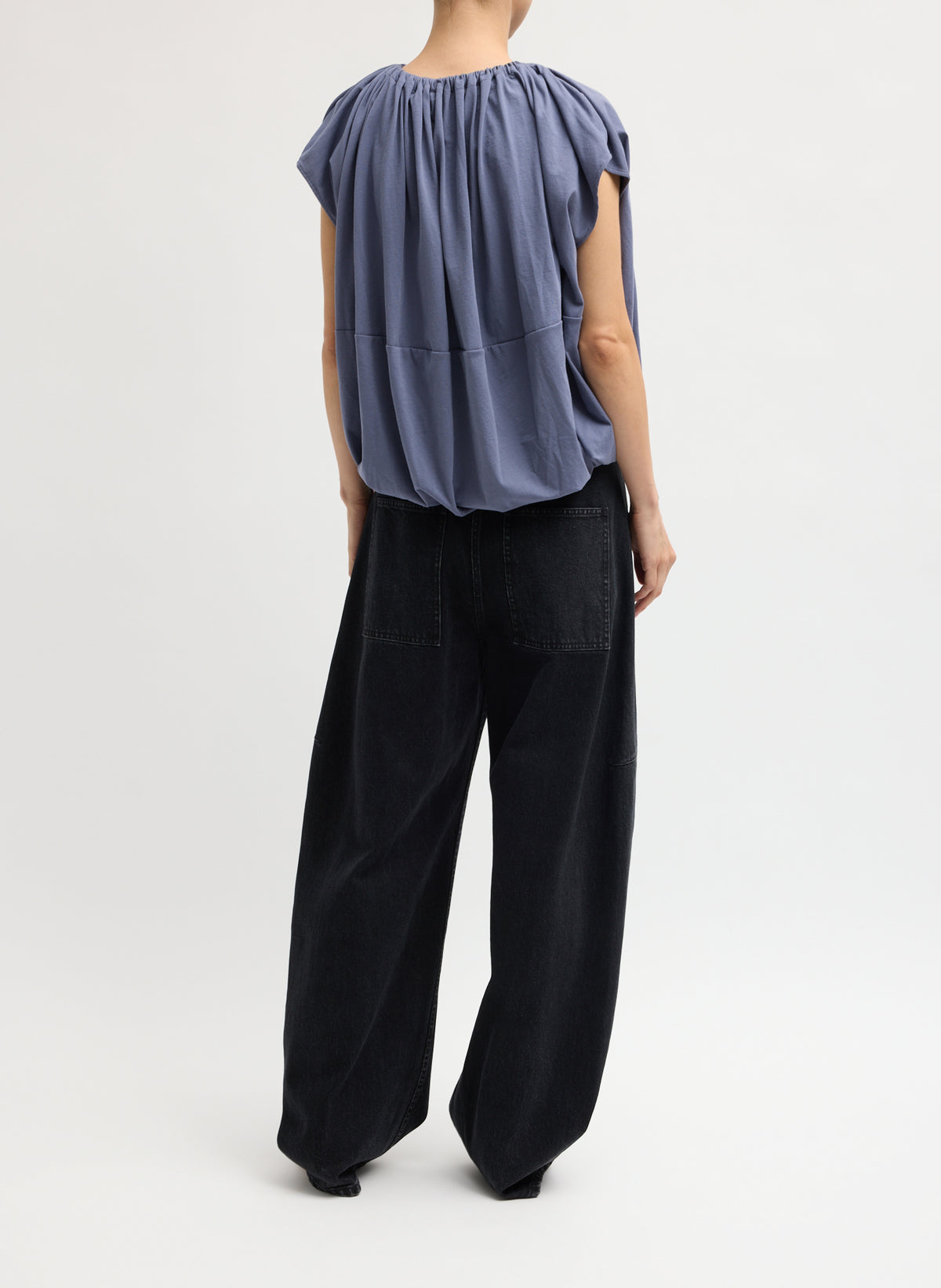 Black Denim Sid Jean - black wash barrel leg jean, back view on model