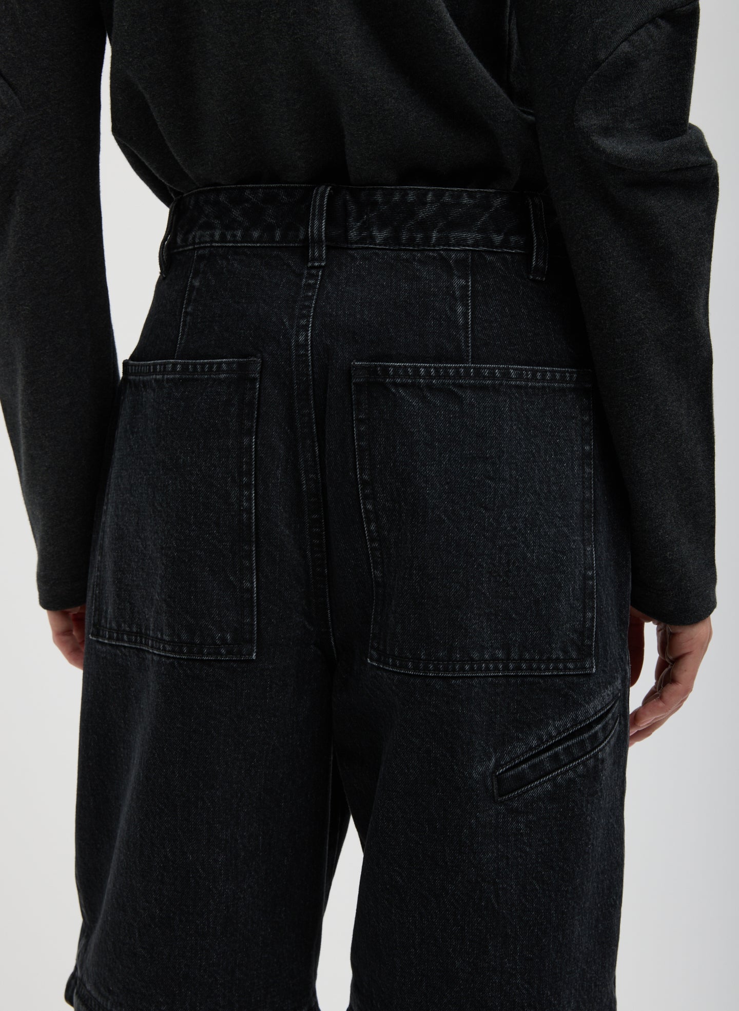 Black Denim Lars Convertible Zip Jean - closeup of back pockets