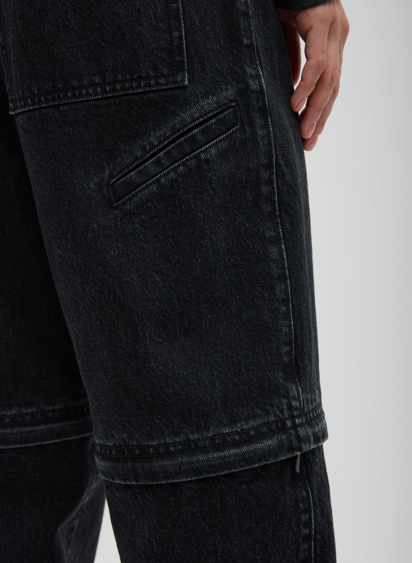 Black Denim Lars Convertible Zip Jean - closeup of back pocket and zip details