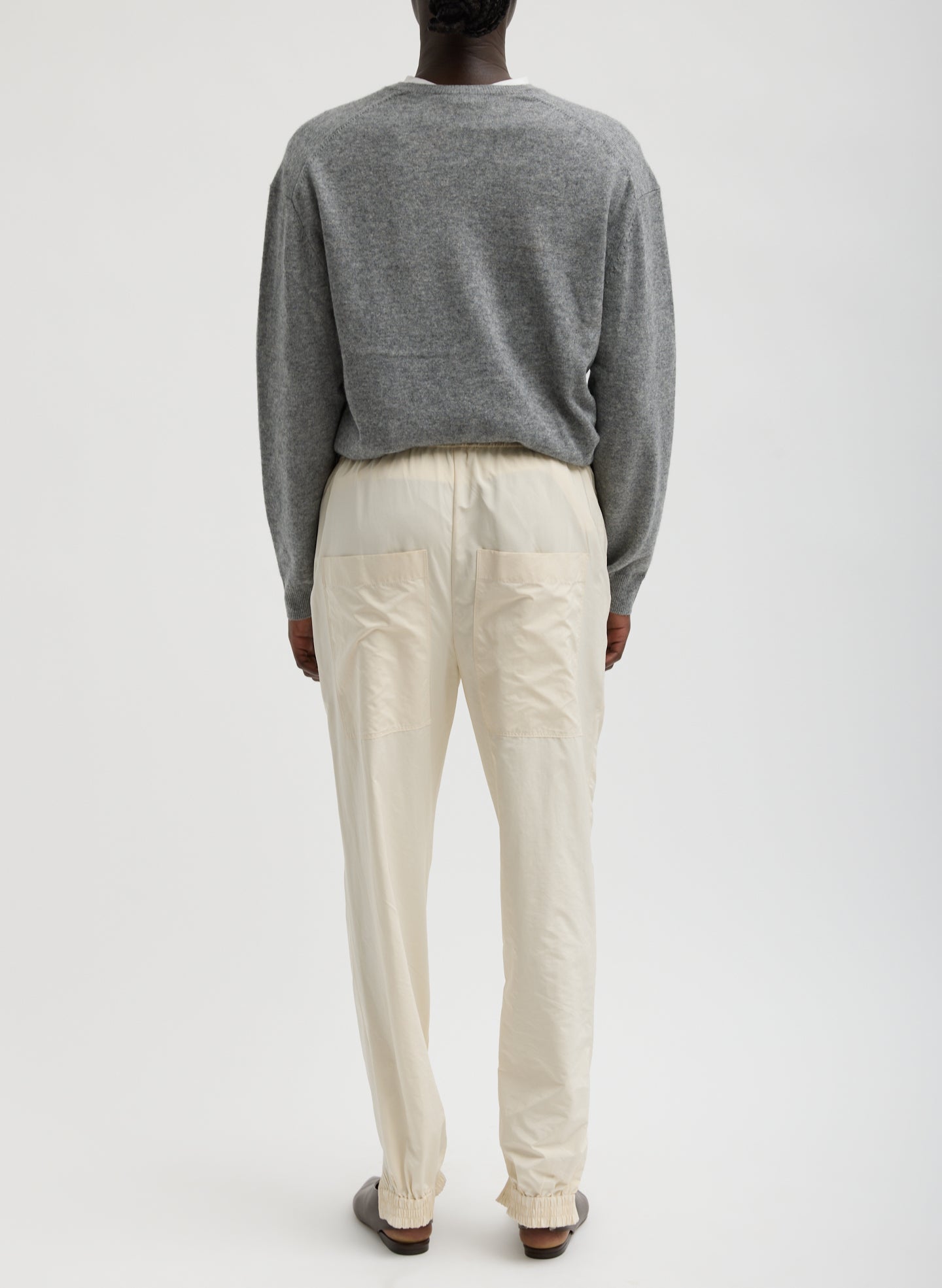 Ivory Nylon Zipper Jogger - full look, back view on model
