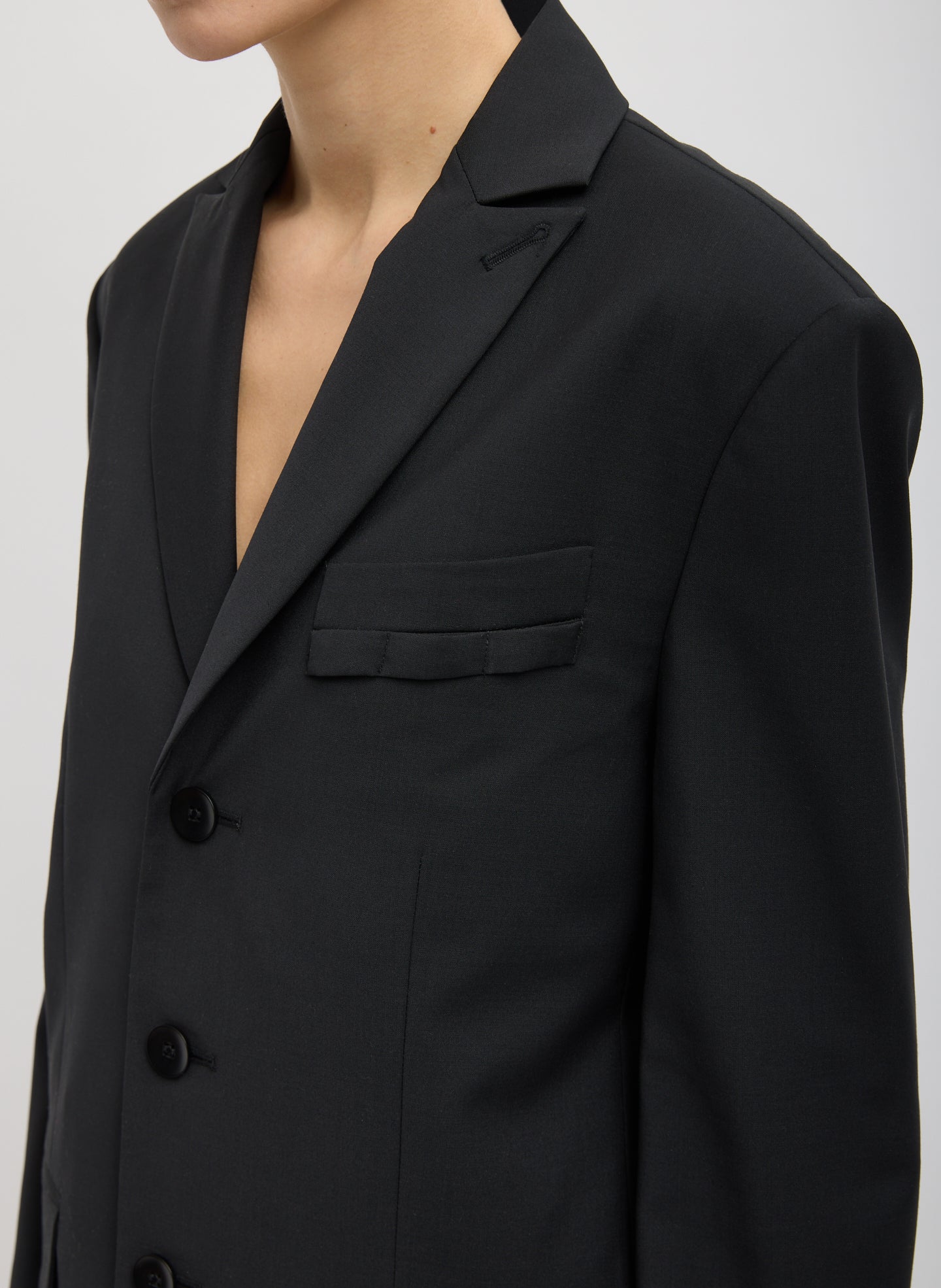 Black Tropical Wool Dennis Cutout Blazer - closeup of lapels and front pocket details