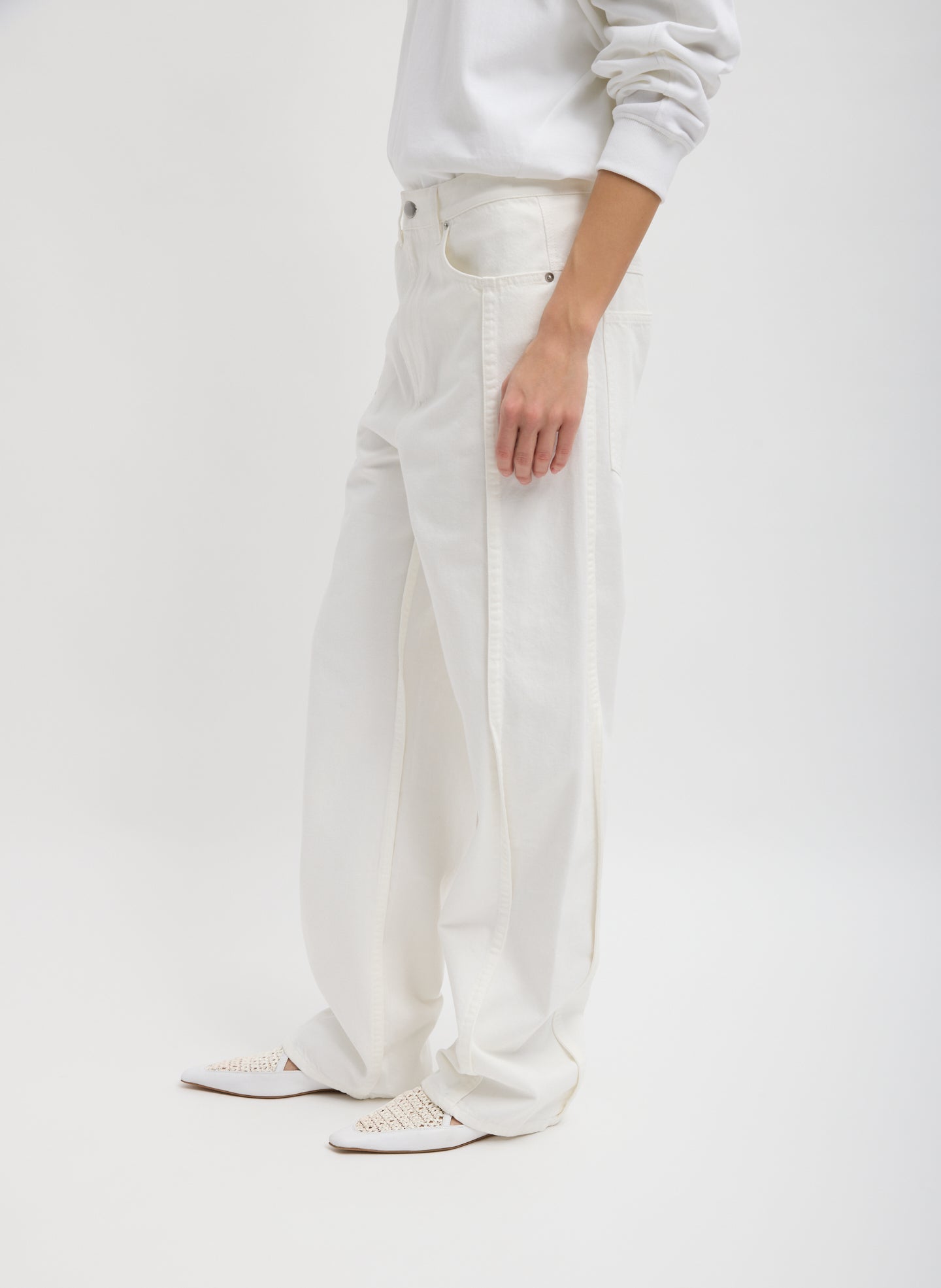 White Spring Denim Tuck Jean - barrel leg, side view on model