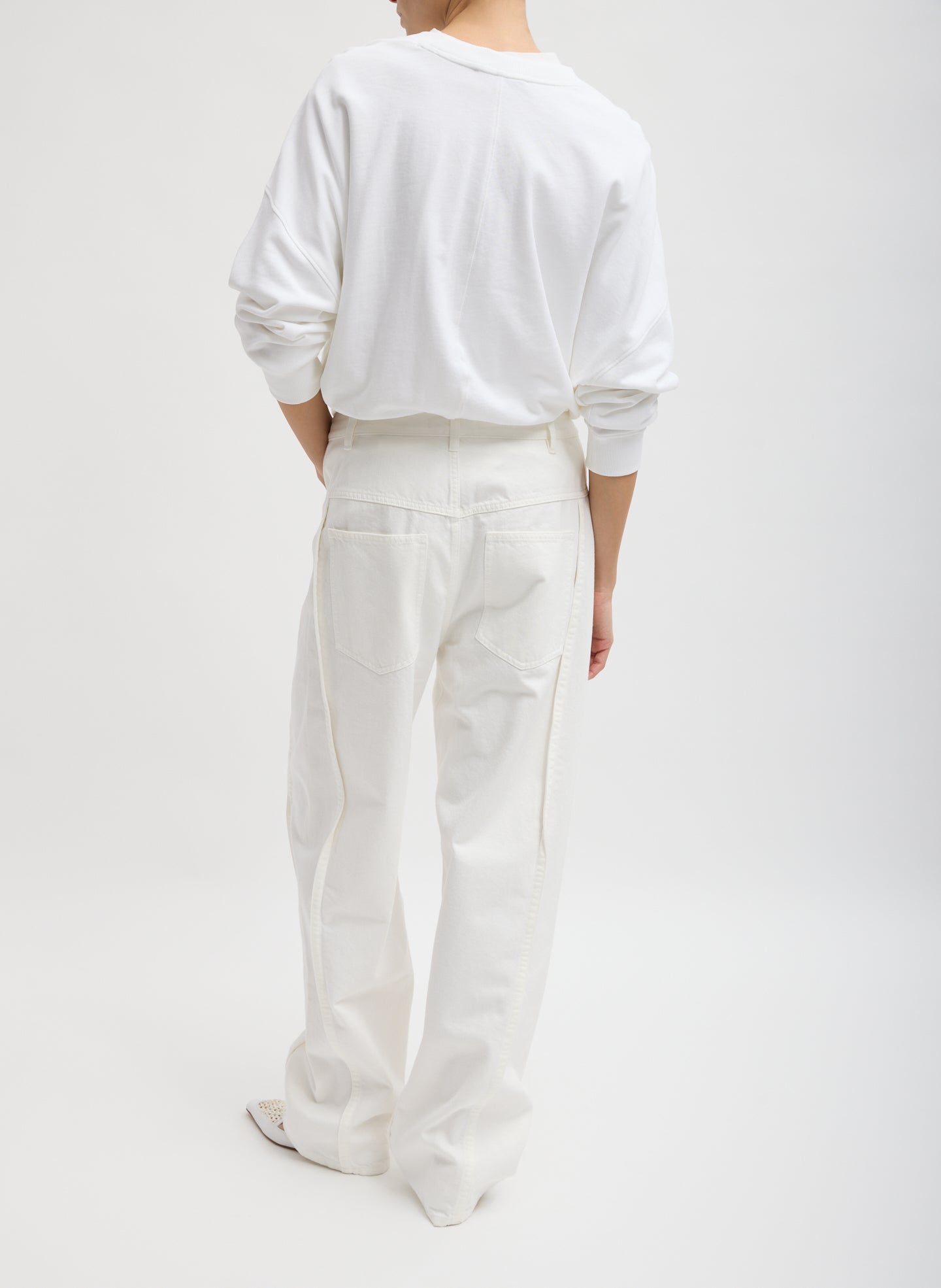 White Spring Denim Tuck Jean - full look, back view on model