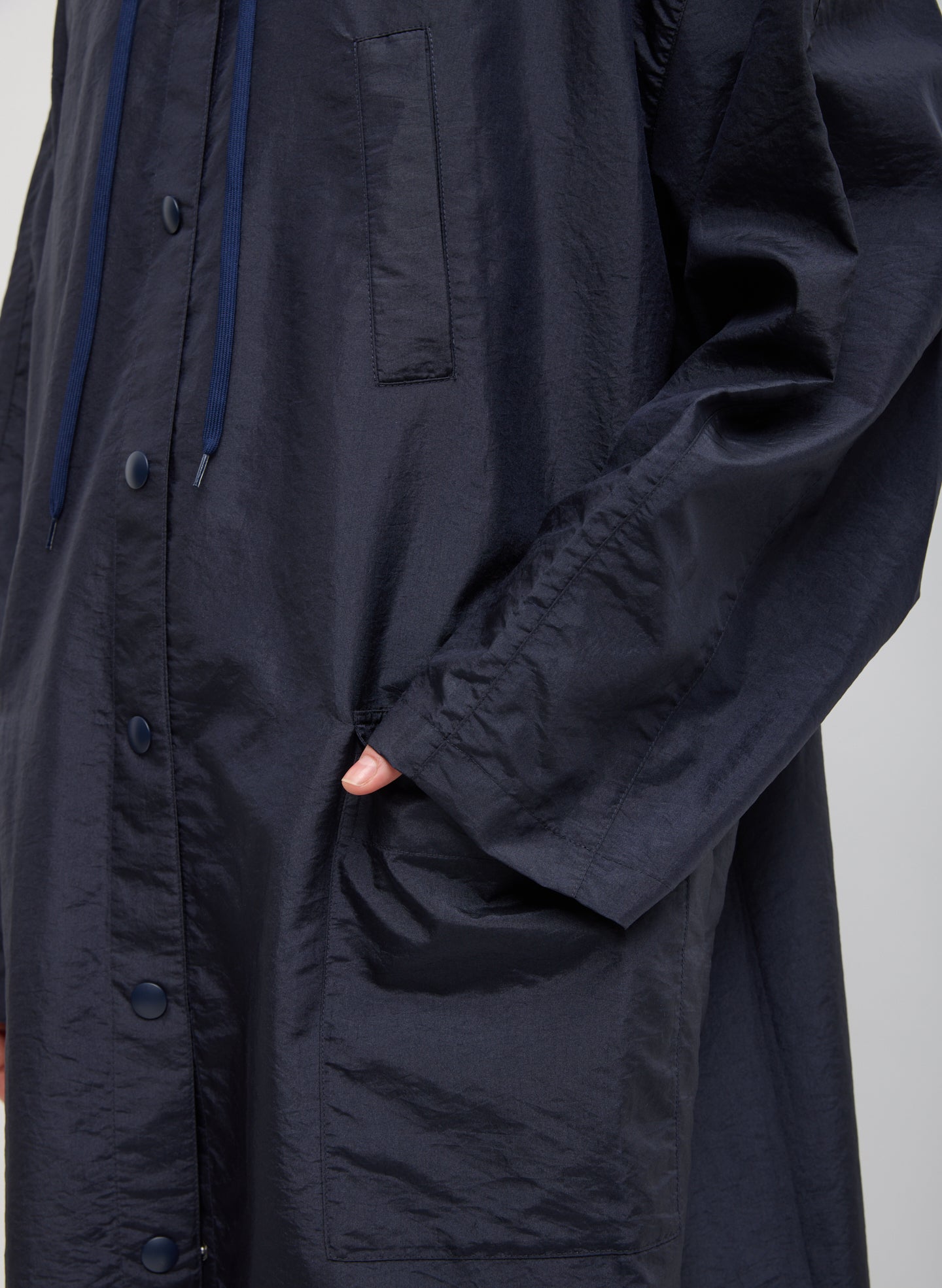 Navy Crispy Nylon Hooded Coat - closeup of front pocket detail