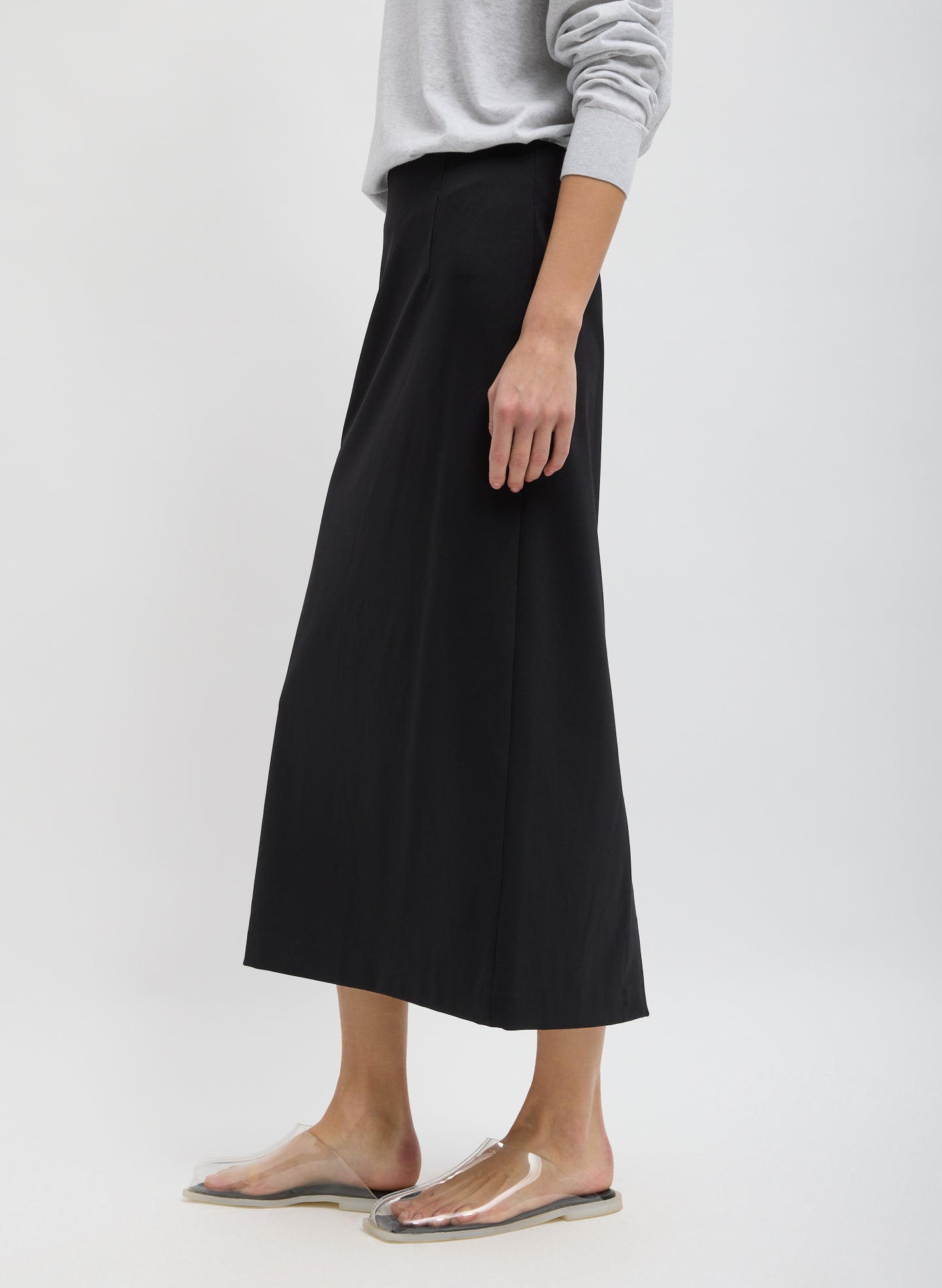 Black Compact Ultra Stretch Knit Pencil Skirt - midi skirt, side view on model