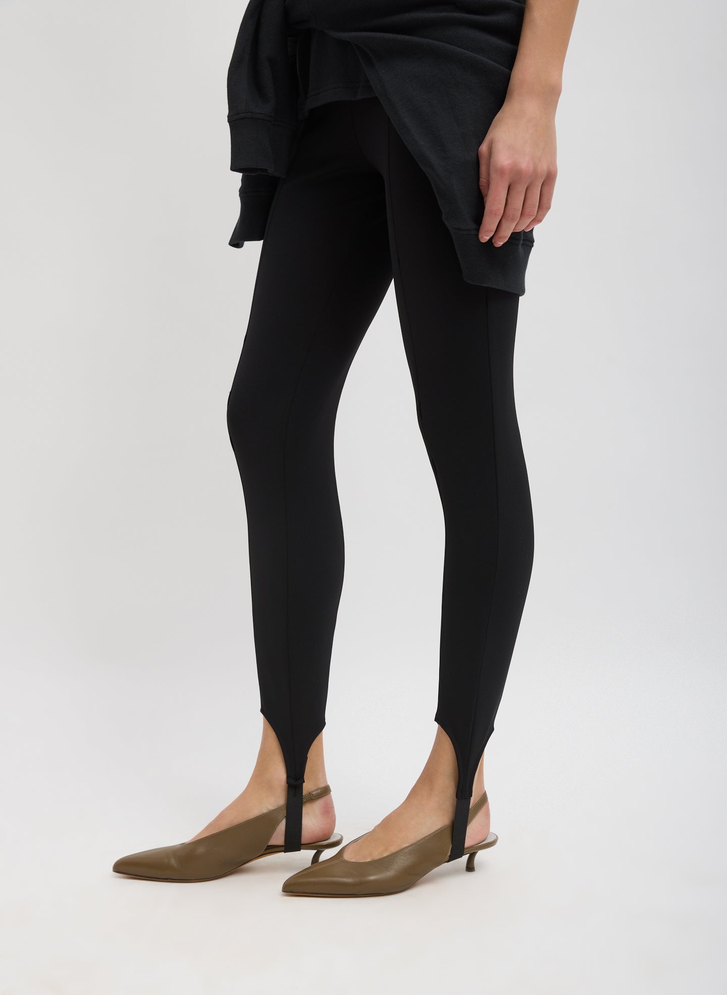 Black Compact Ultra Stretch Knit Stirrup Legging - side view on model