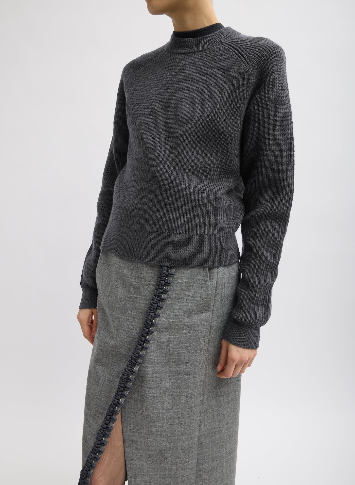 Dark Heather Grey Cardigan Stitch Wool Shrunken Crewneck Pullover - side view on model