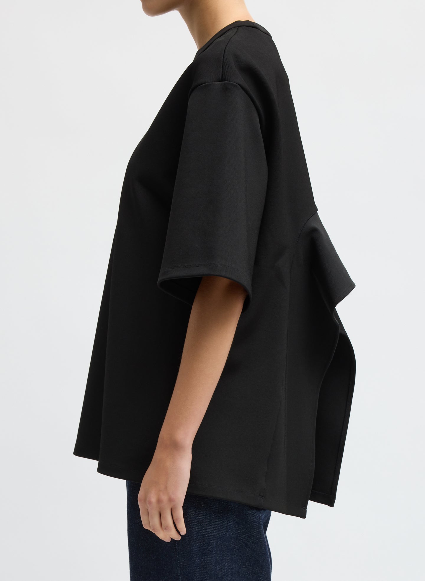 Black Luxe Crepe Knit Easy Tunic Top - short sleeve t-shirt, side view on model