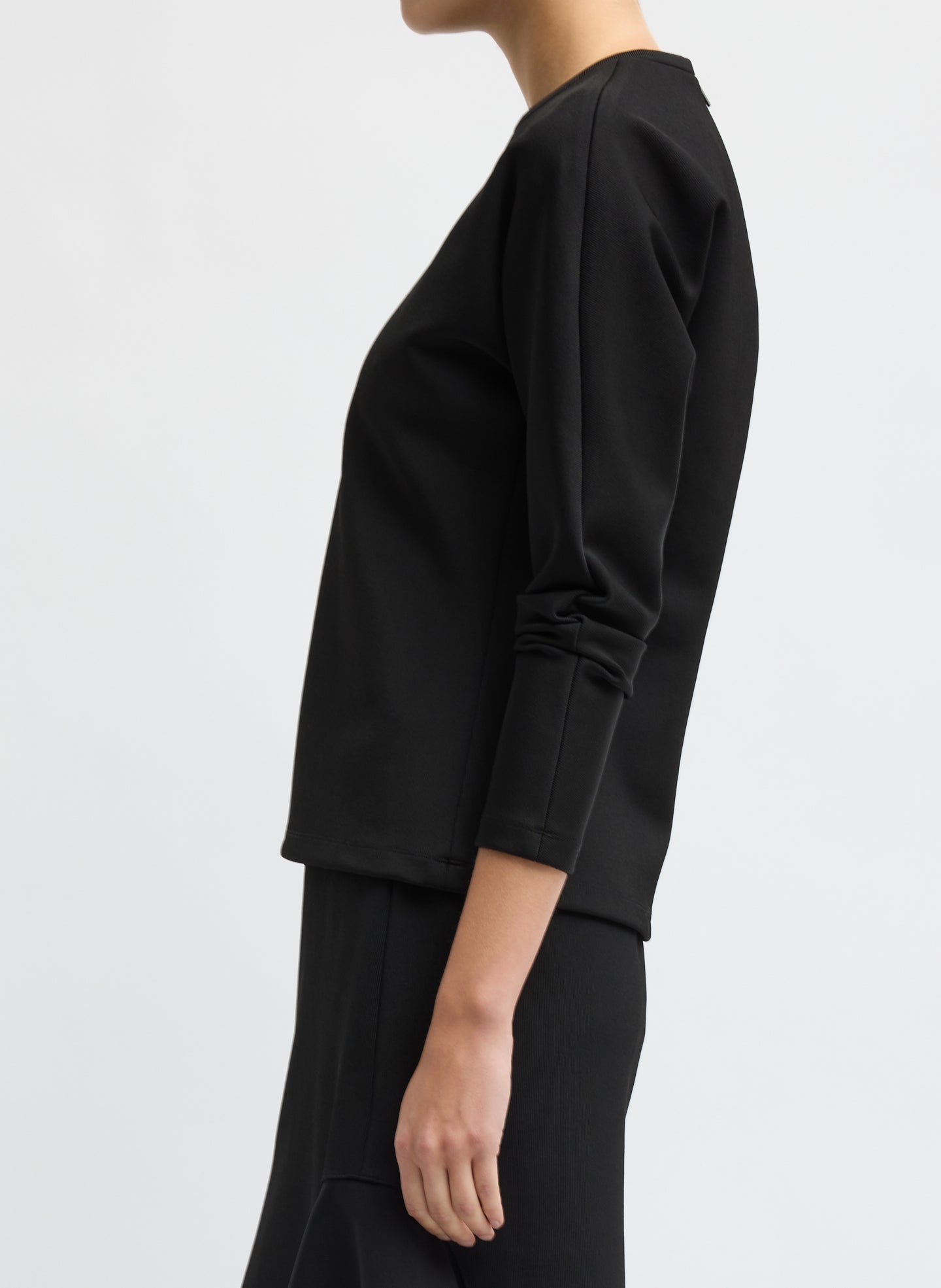 Black Luxe Crepe Knit Dolman Top - long sleeve top, side view on model