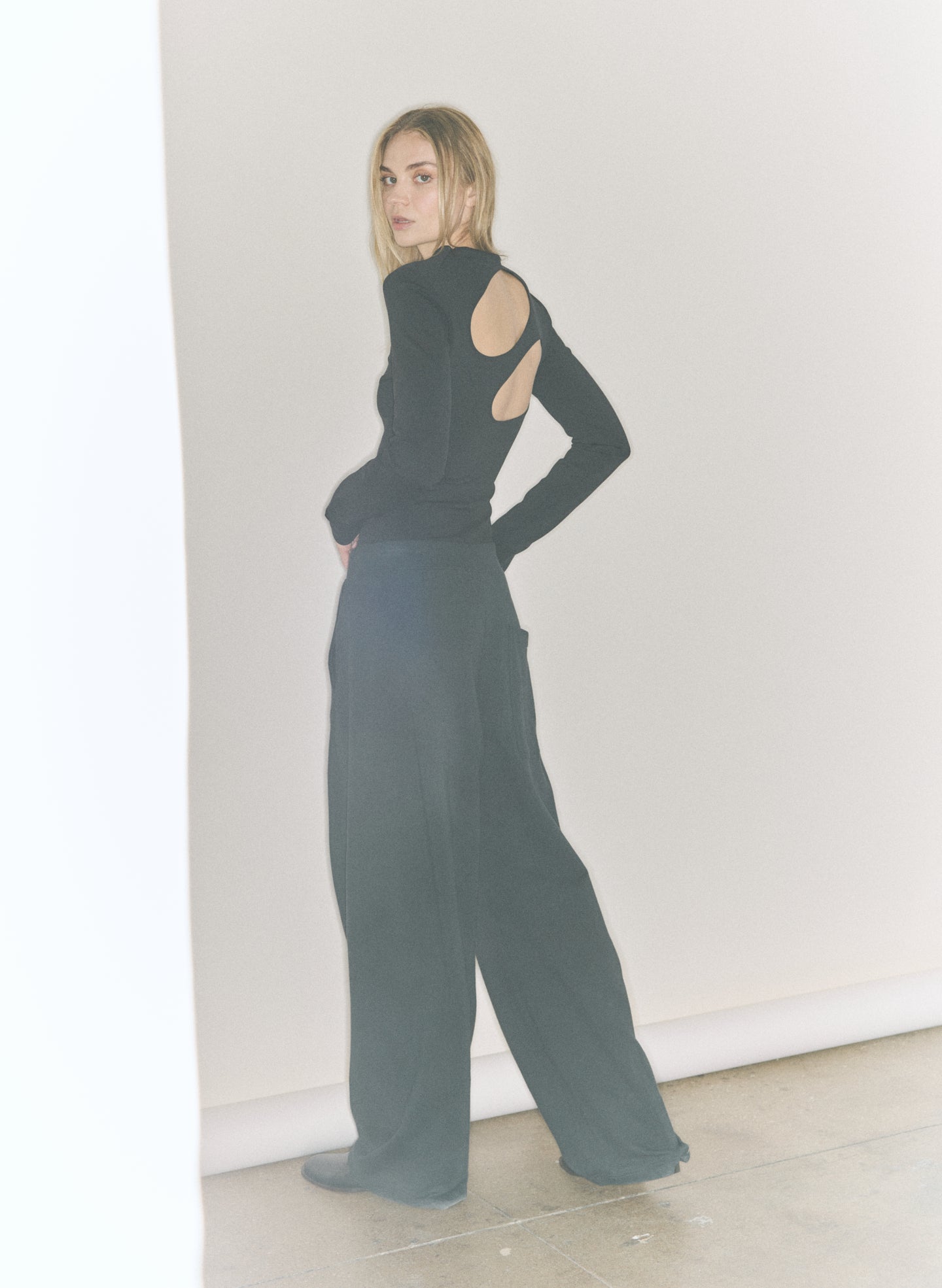 Black Compact Ultra Stretch Cut Out Back Top - editorial image on model