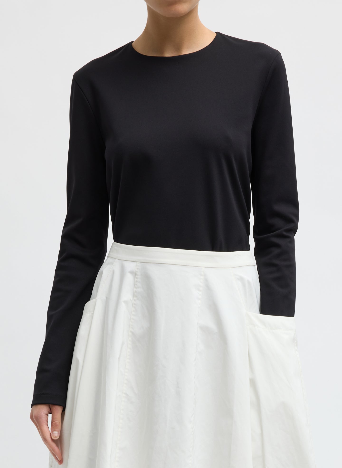 Black Compact Ultra Stretch Knit Long Sleeve Slim Top - front view on model
