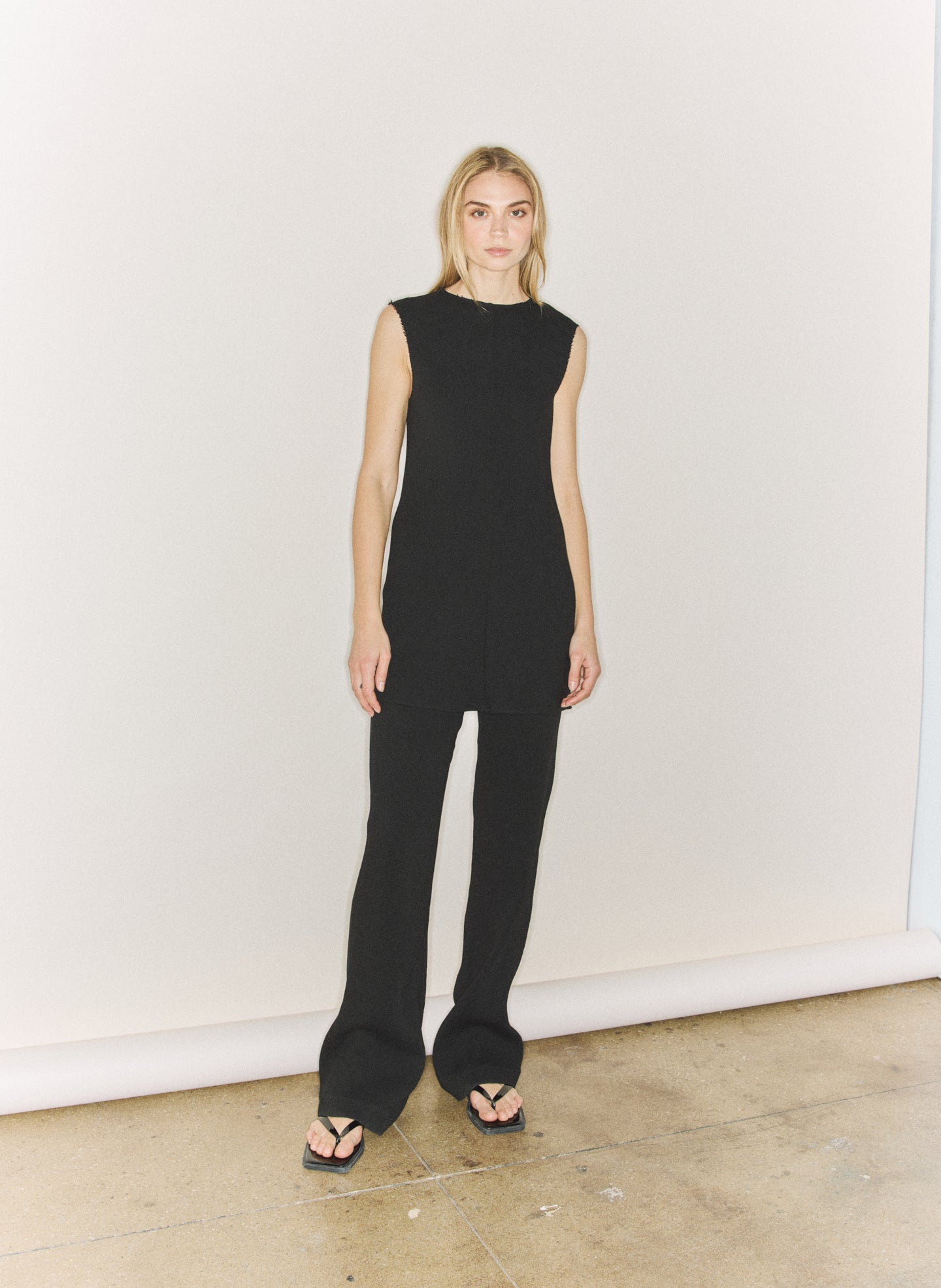 Black Viscose Plisse Sleeveless Bias Short Tunic - editorial image on model