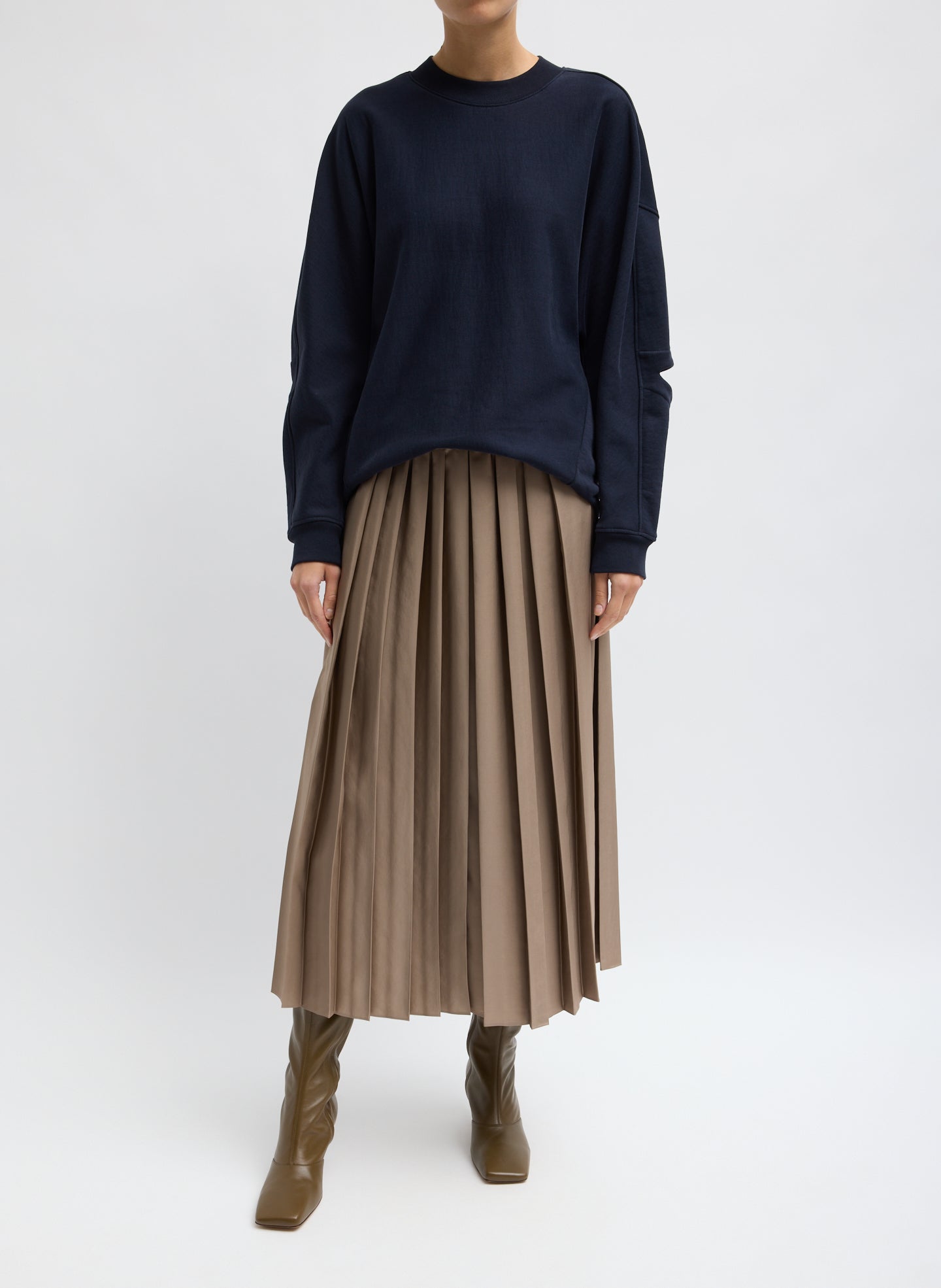 Latte Feather Weight Pleated Pull On Skirt - front view on model
