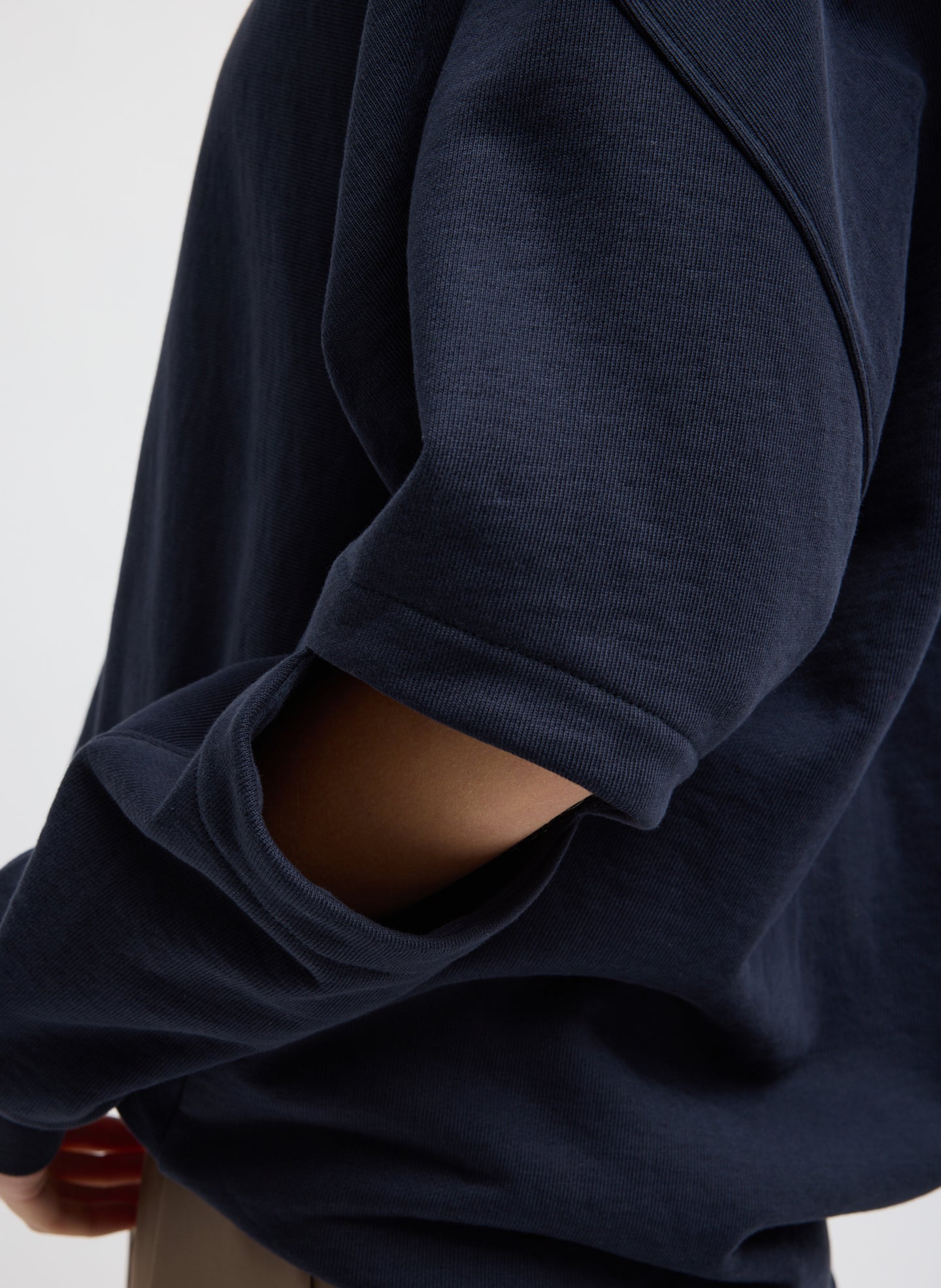 Navy Cocoon Crewneck Sweatshirt - closeup of cutout detail at elbow