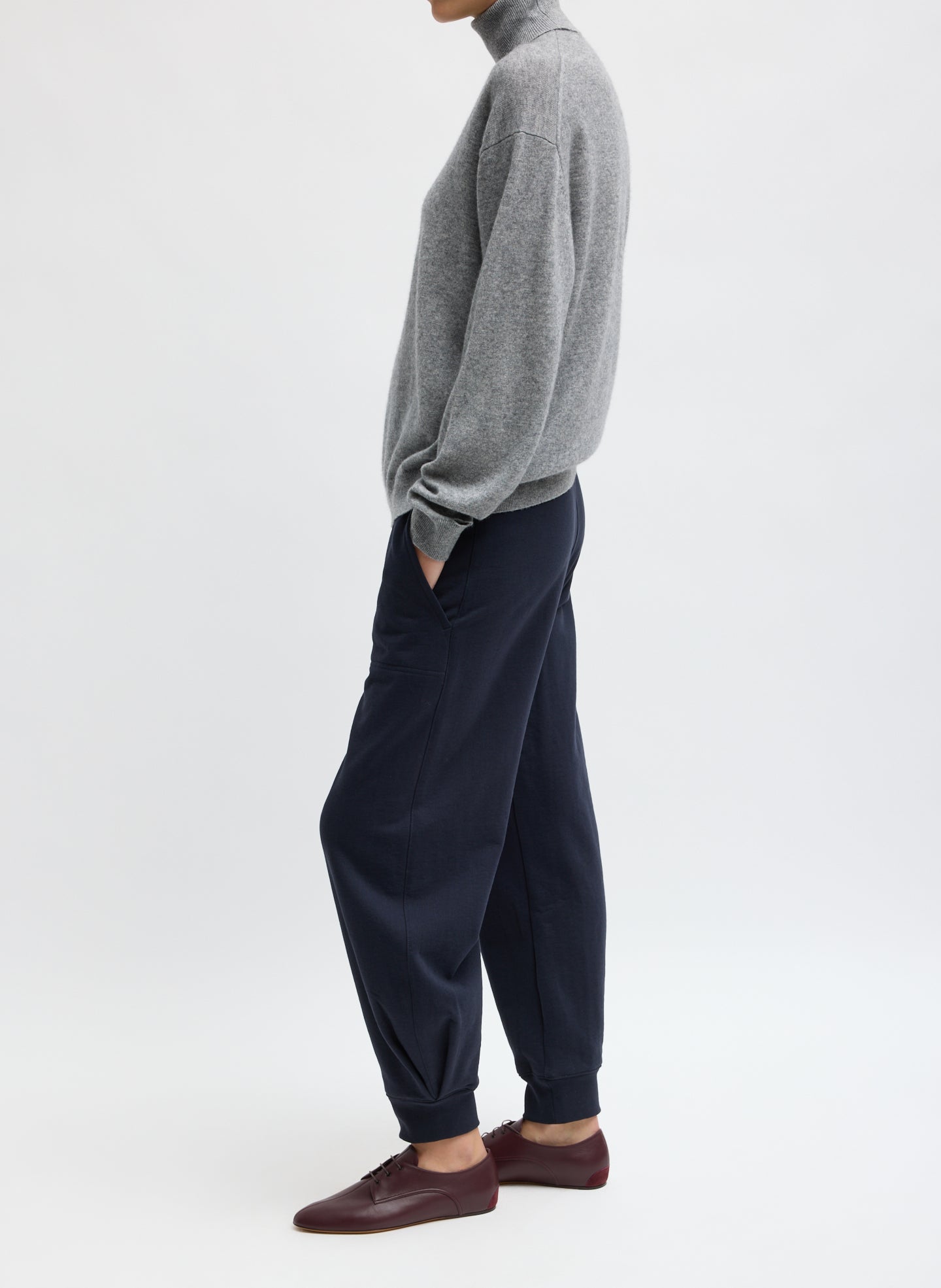 Navy Calder Sweatpant - barrel leg sweatpant, side view on model