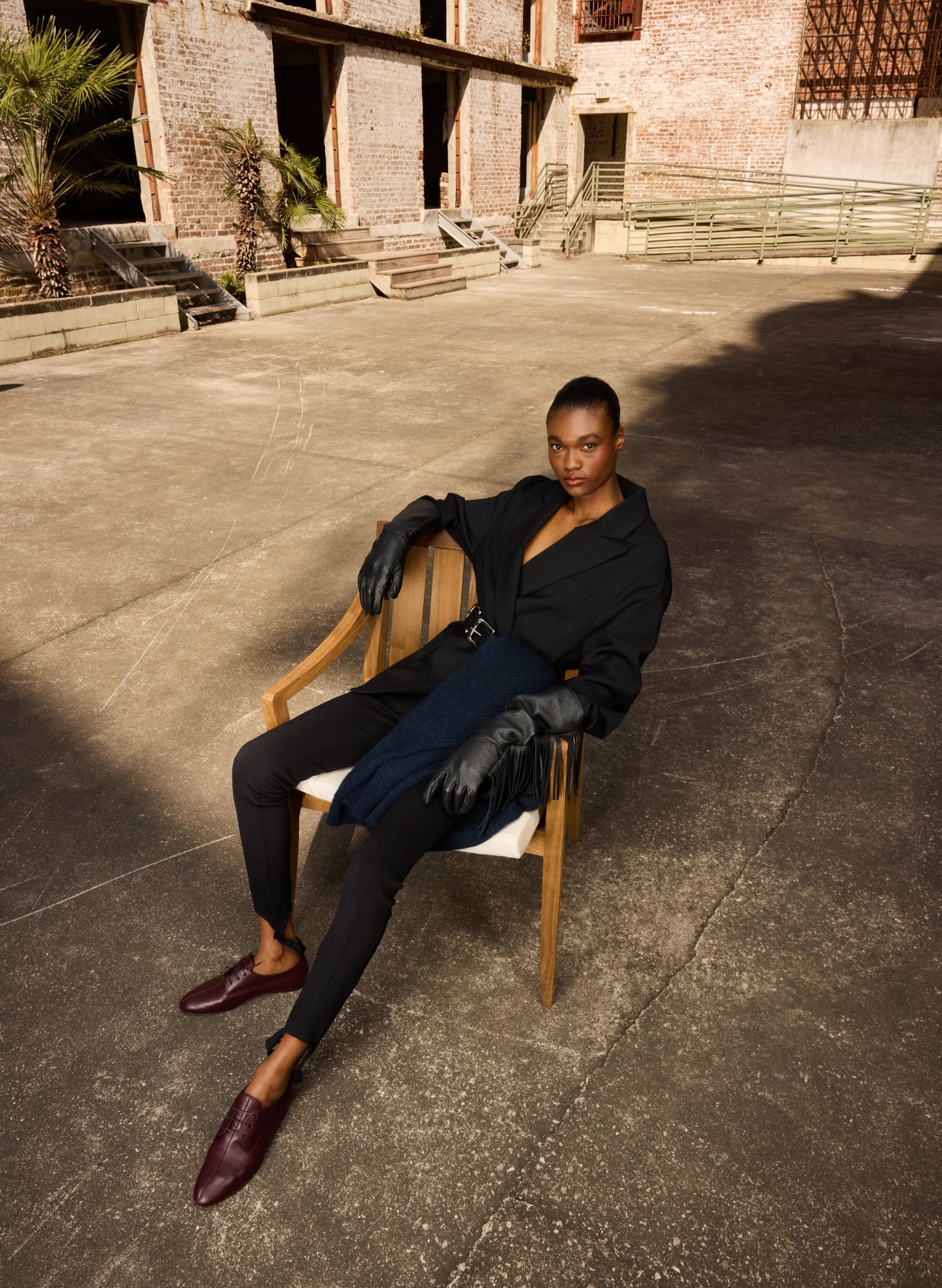 Black Long Fringe Leather Gloves - editorial image on model