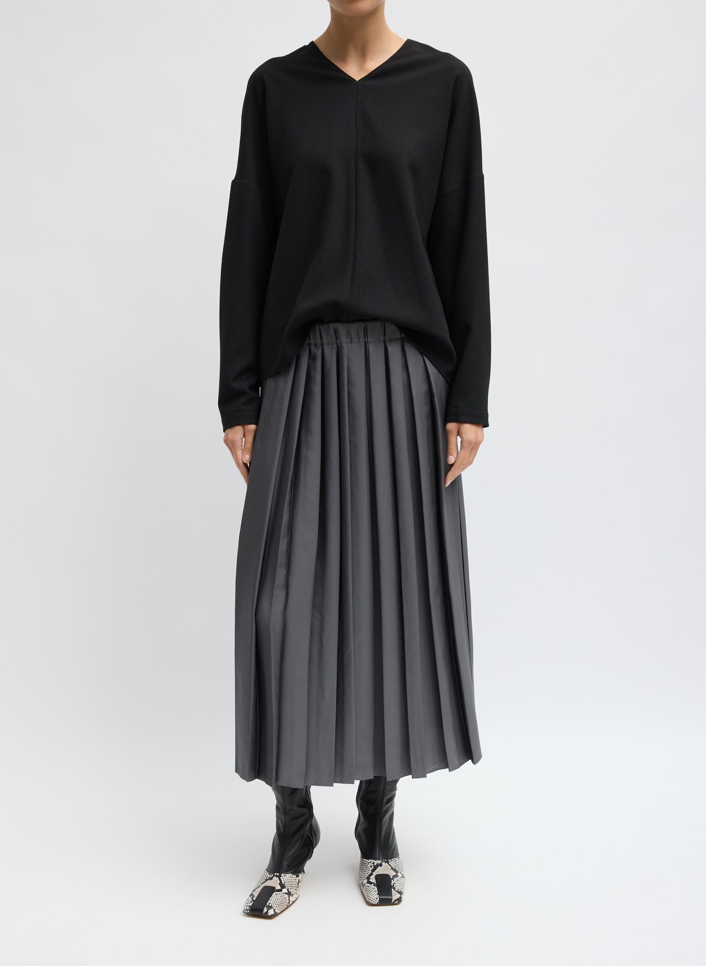 Grey Feather Weight Pleated Pull On Skirt - front view on model