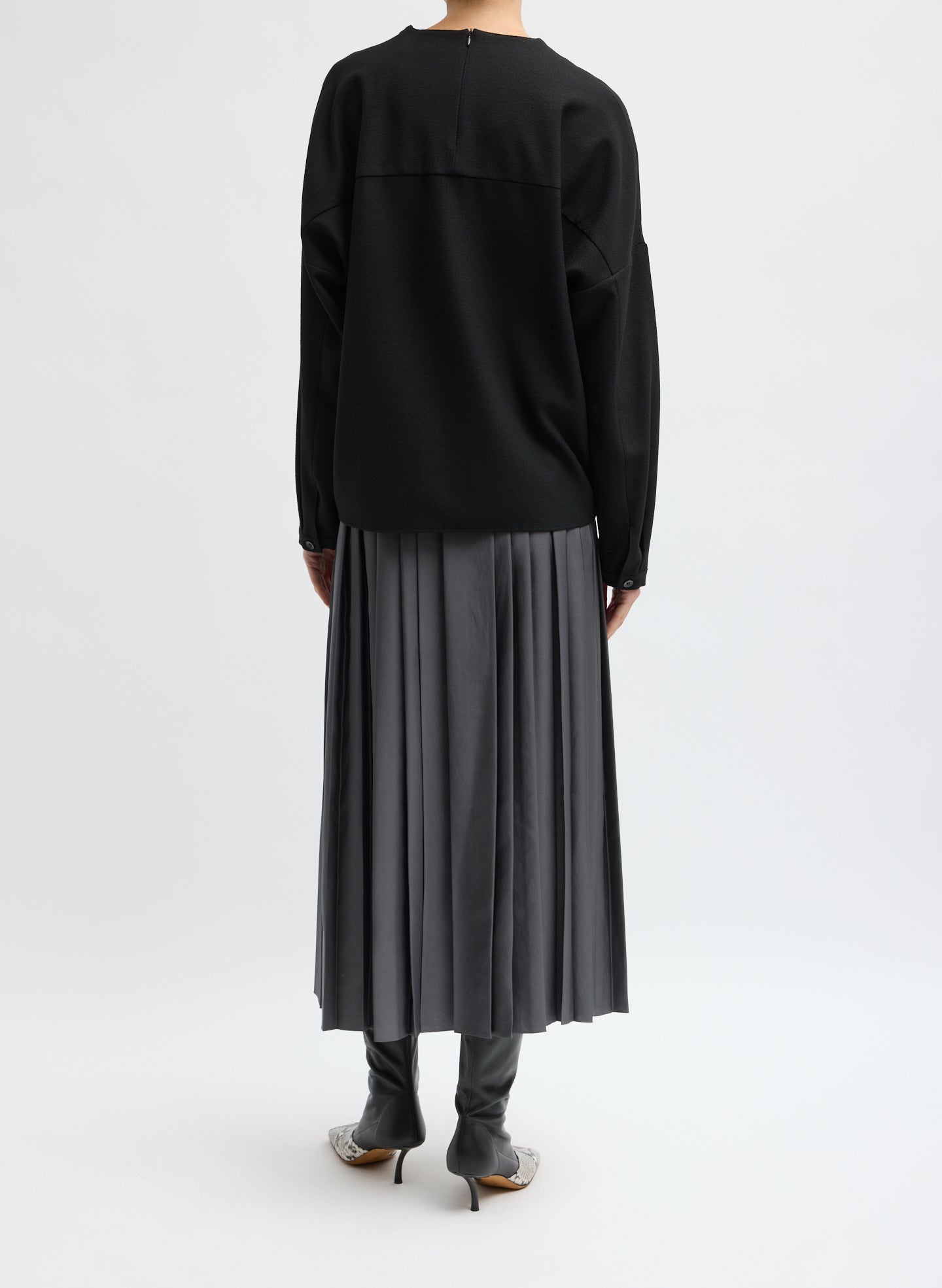 Grey Feather Weight Pleated Pull On Skirt - back view on model