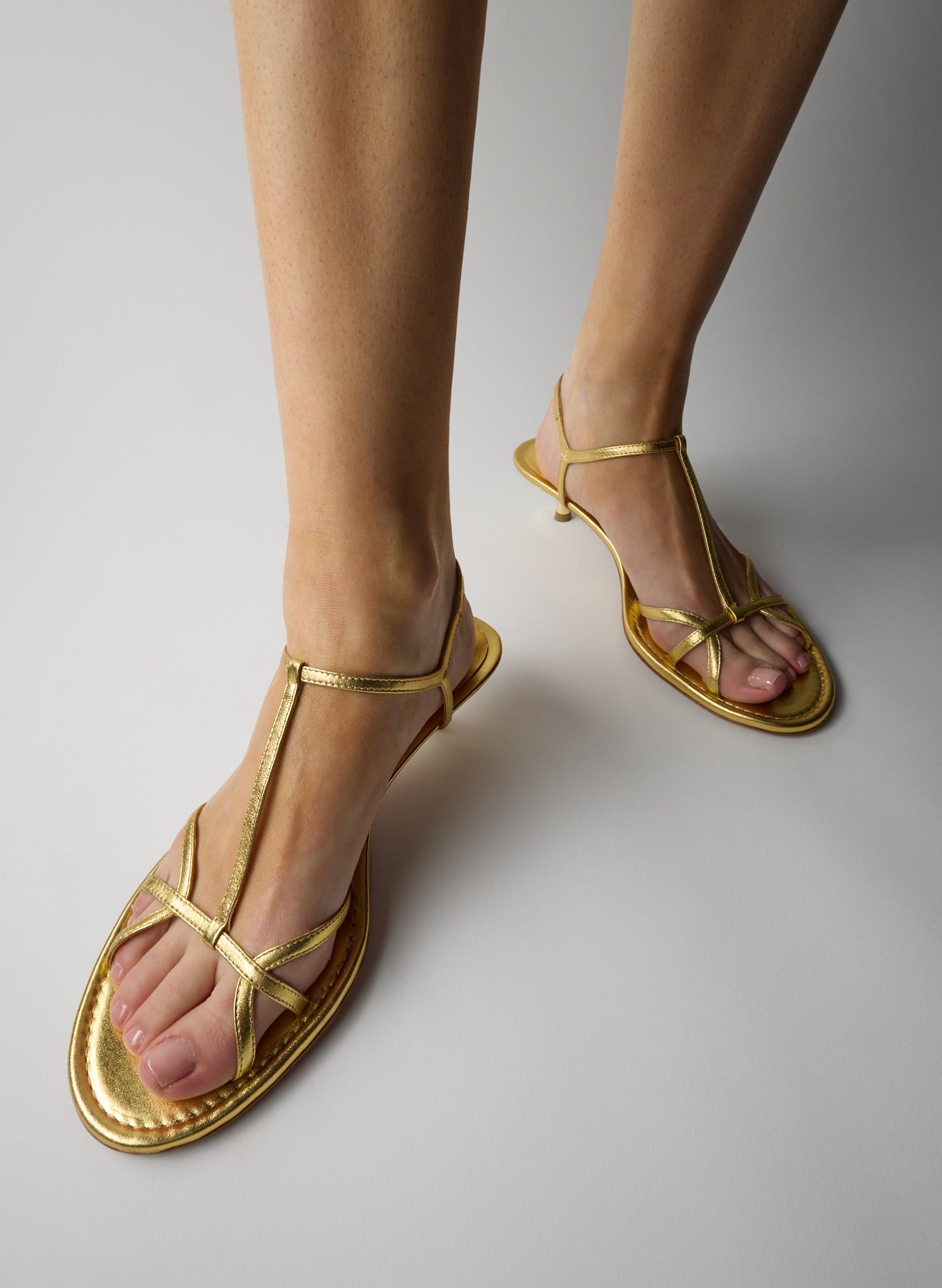 Gold Christopher Metallic Nappa Heel - heeled leather sandal, on model