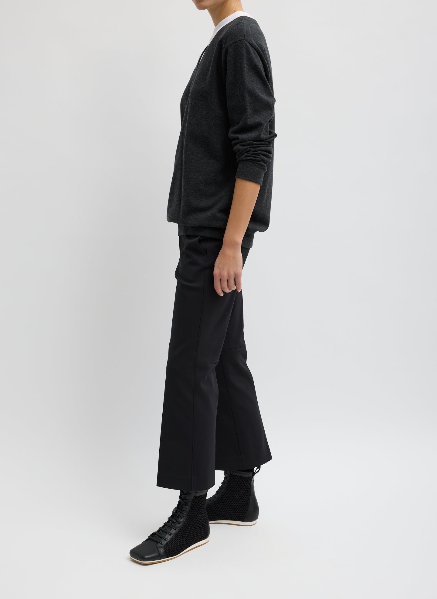 Black Compact Tech Knit Cropped Bootcut Pant - full look, side view on model