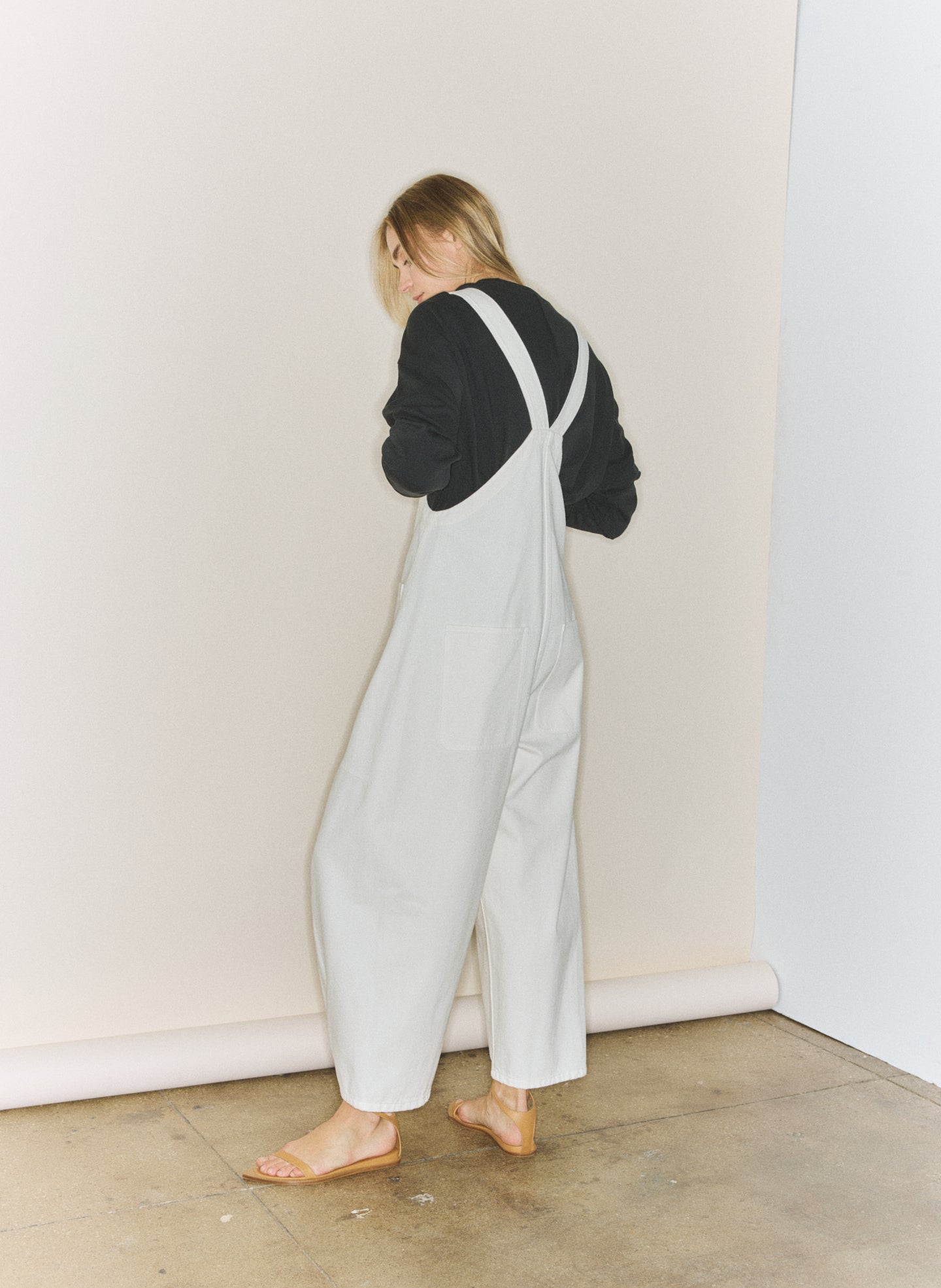 White Denim Jumpsuit - editorial image on model