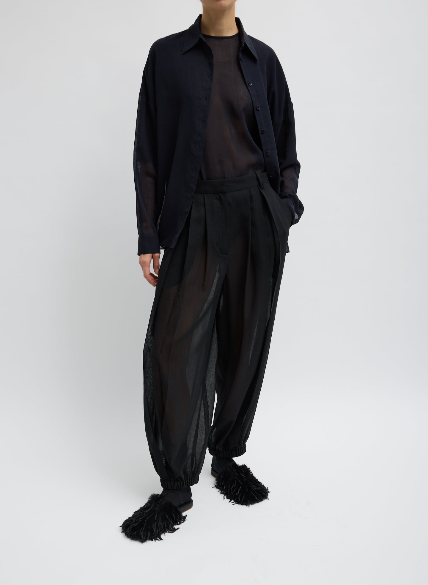Black Sheer Wool Gauze Pleated Balloon Pant – relaxed fit, front view on model