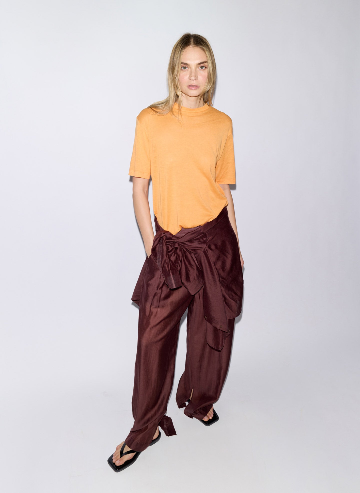 Orange Sheer Crepe Knit Mock Neck Unisex T-Shirt - editorial image on model