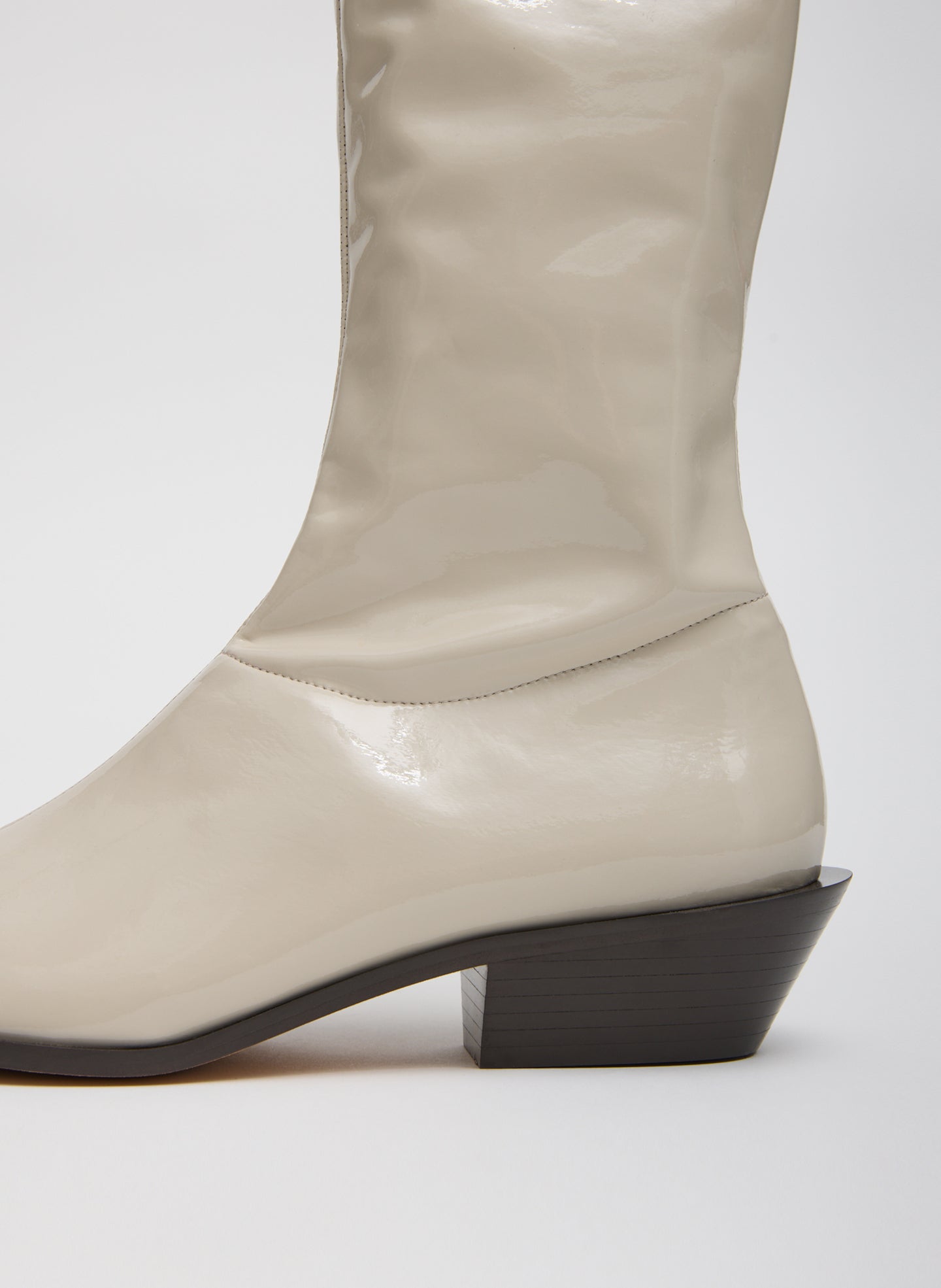 Taupe Bronson Boot - Narrow Calf - closeup of patent leather and heel