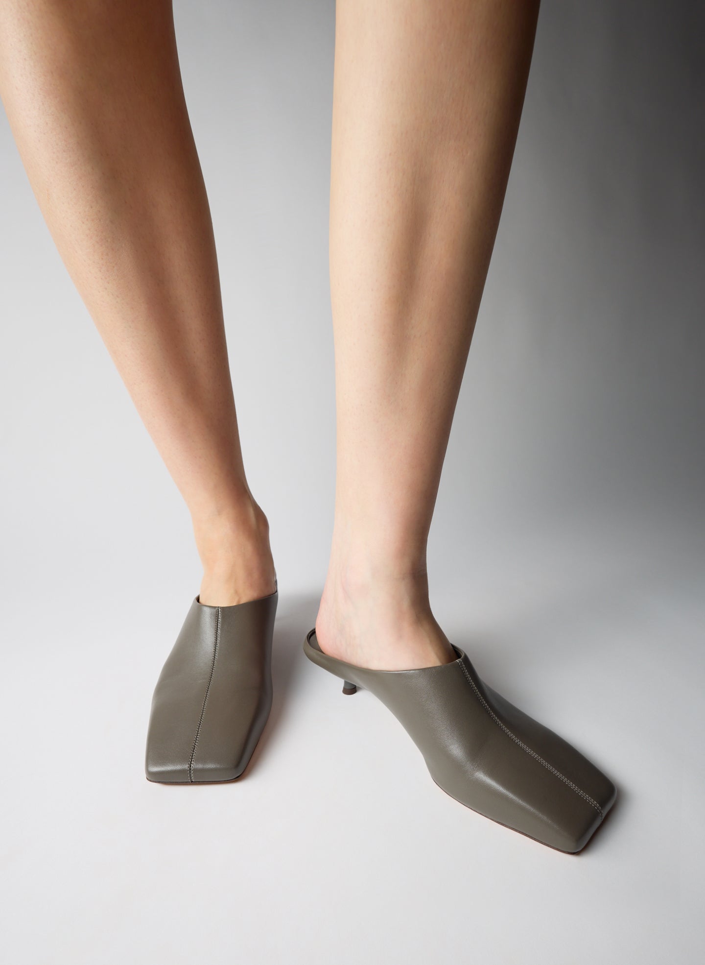 Warm Grey Leather Gwinnett Heeled Mule - on model