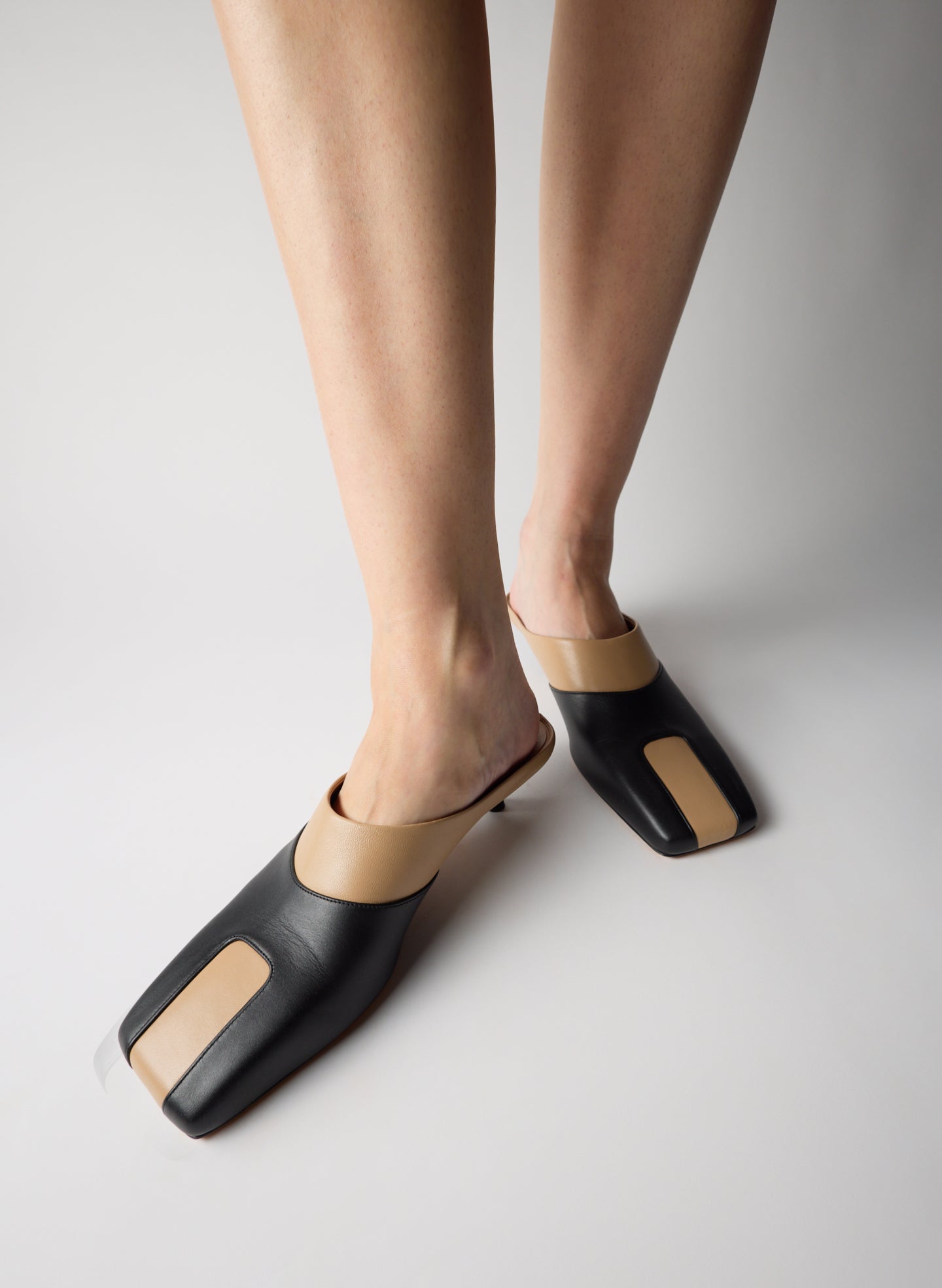 Two Tone Beige and Black Leather Gwinnett Heeled Mules - on model