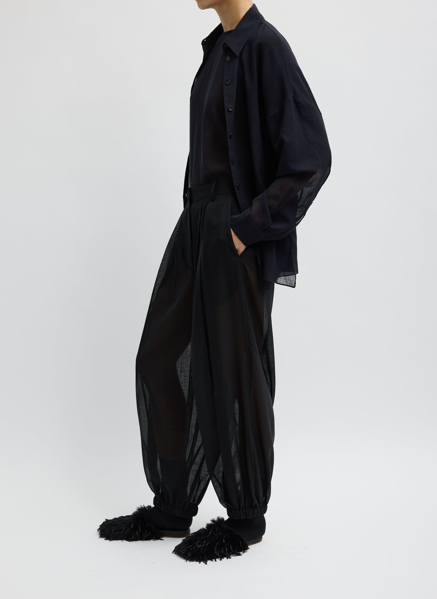 Black Sheer Wool Gauze Pleated Balloon Pant – relaxed fit, side view on model
