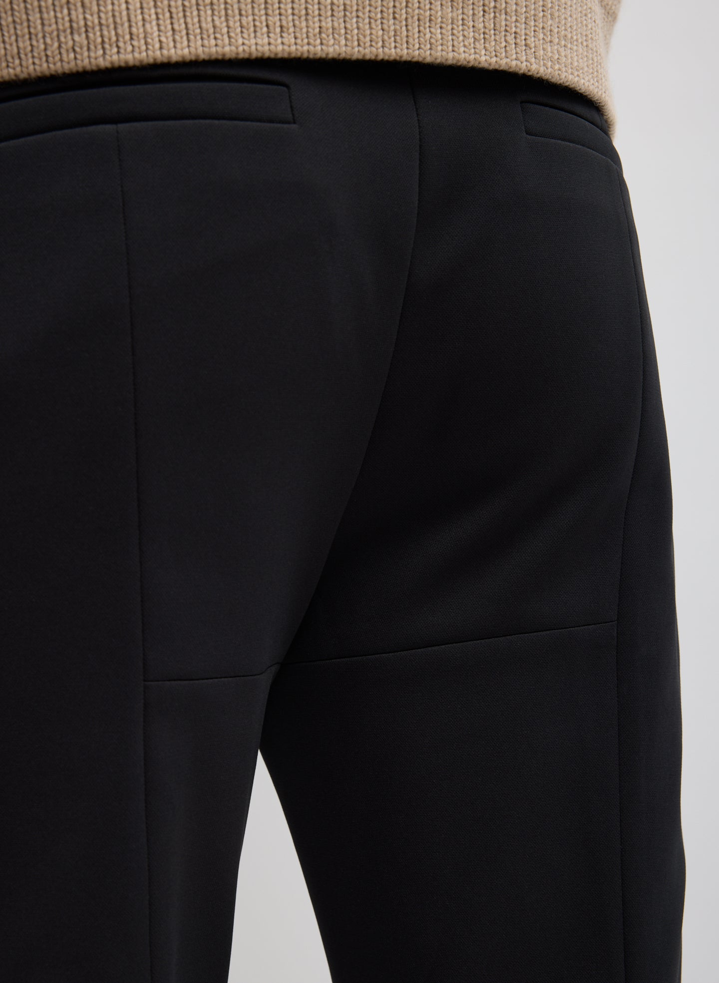 Black Compact Tech Knit Cropped Bootcut Pant - closeup of stitch details