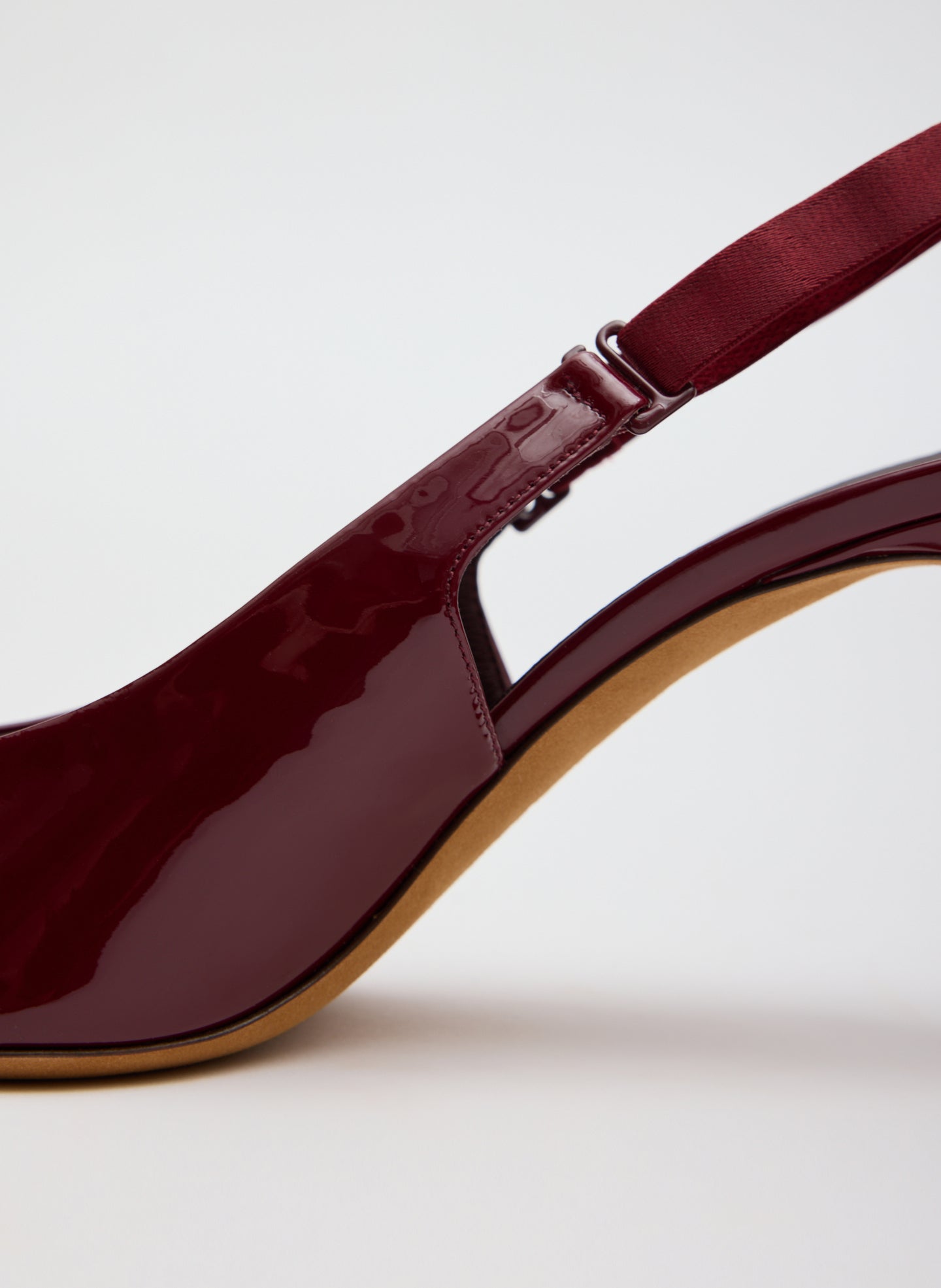 Burgundy Patent Leather Beasley Pump - closeup of back strap detail