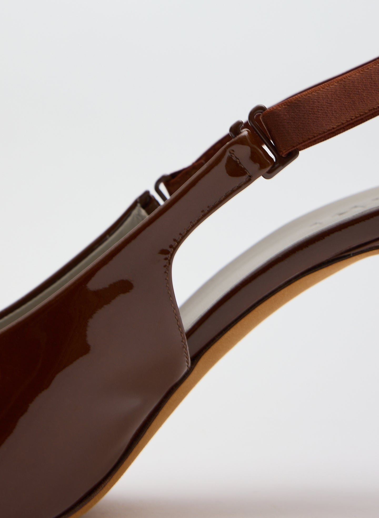 Dark Honey Patent Leather Beasley Pump - closeup of back strap detail