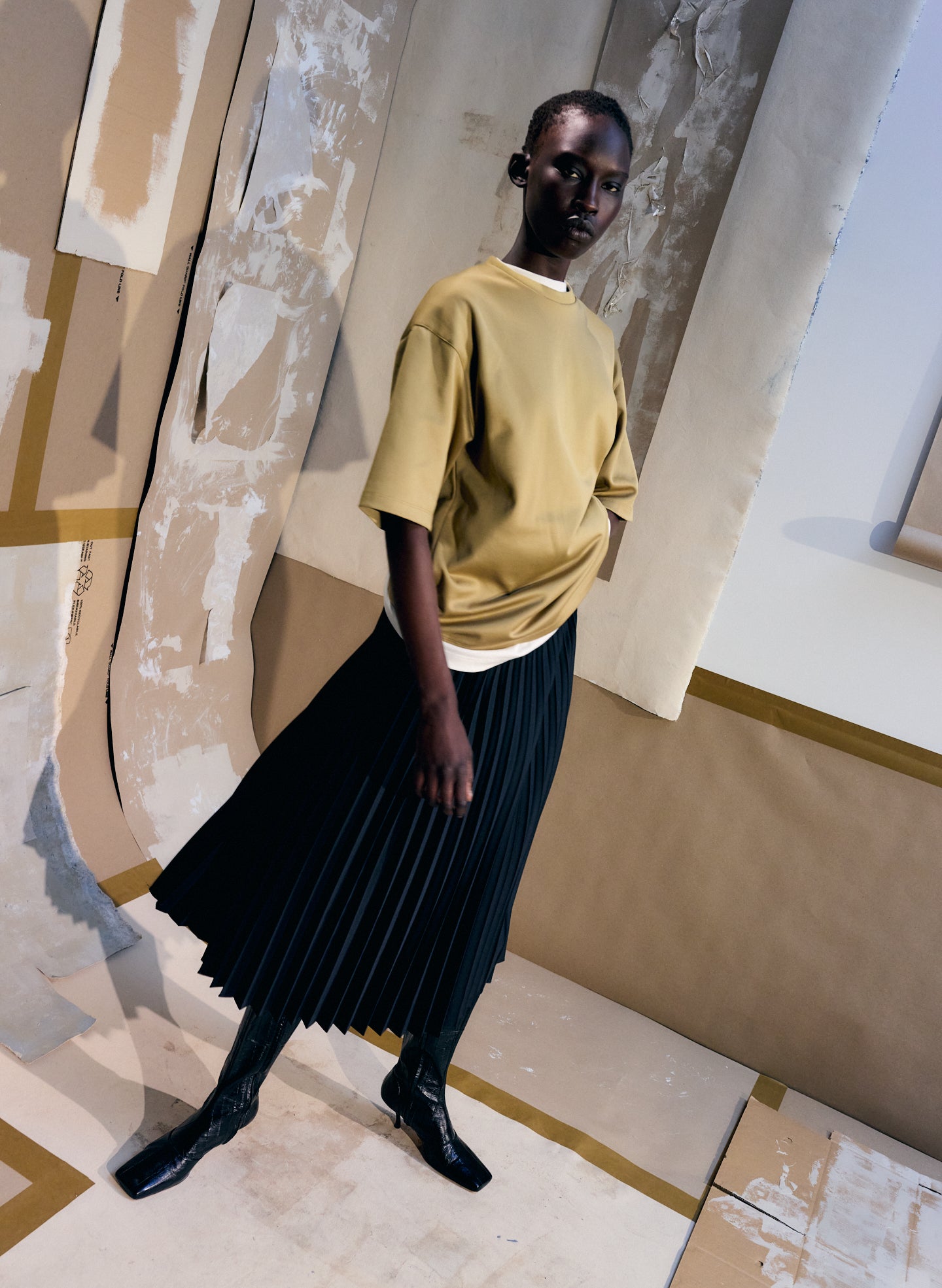Black Tropical Wool Pleating Sunray Skirt - pleated midi skirt, editorial image on model