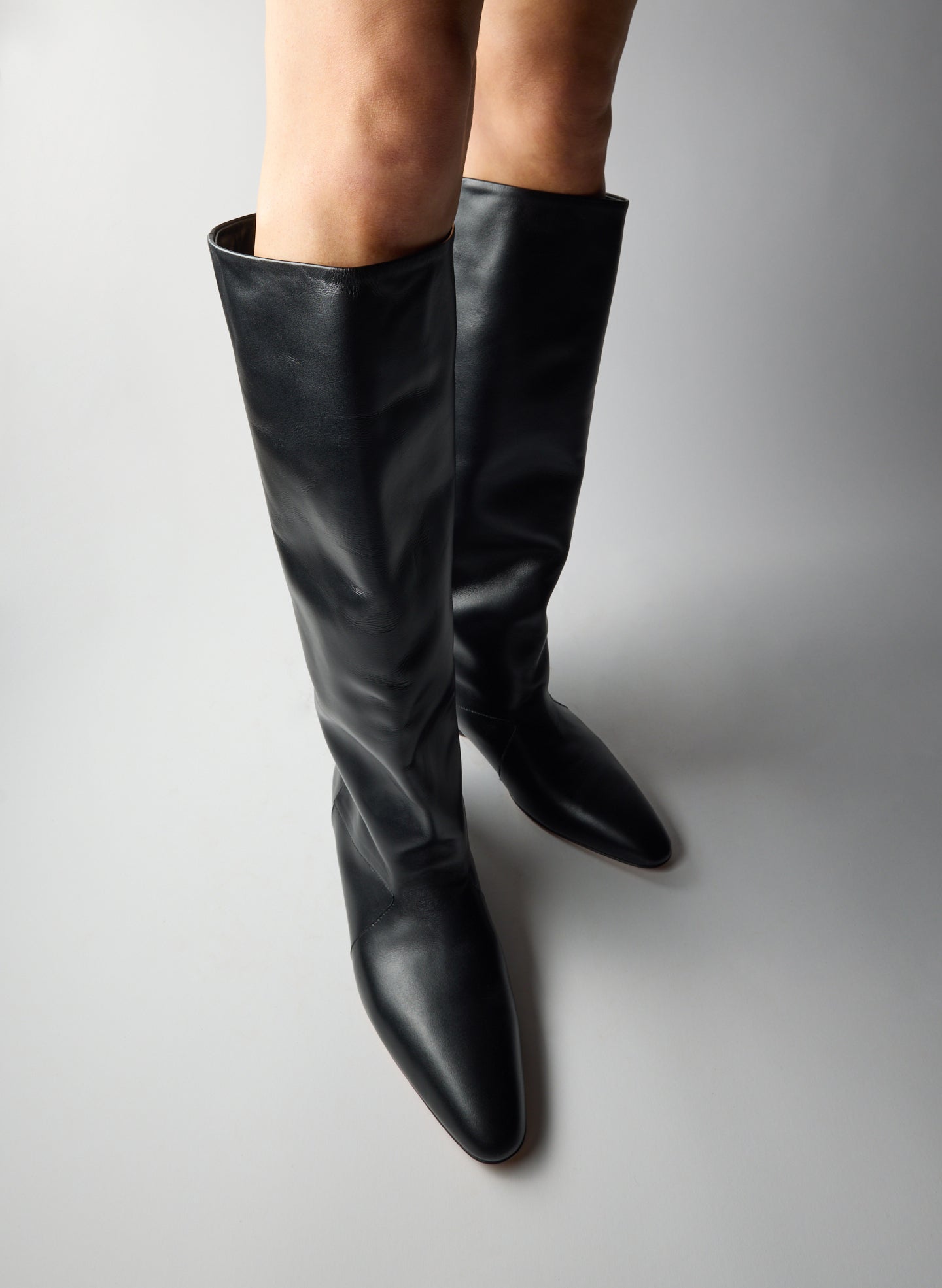 Black Kuda Boot - slouchy, knee-high leather boot, on model