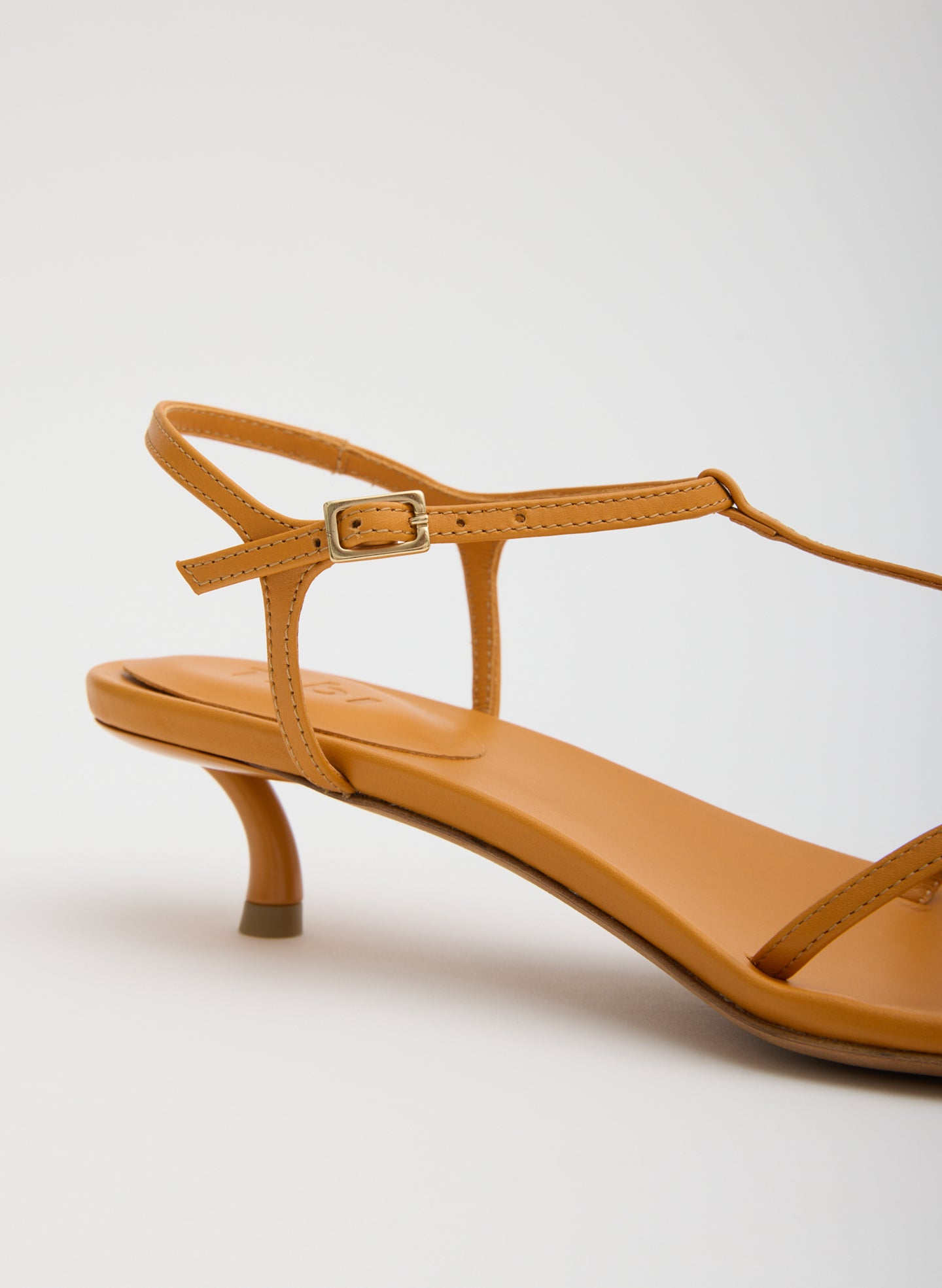 Bright Ochre Christopher Heel - closeup of leather strap and buckle detail
