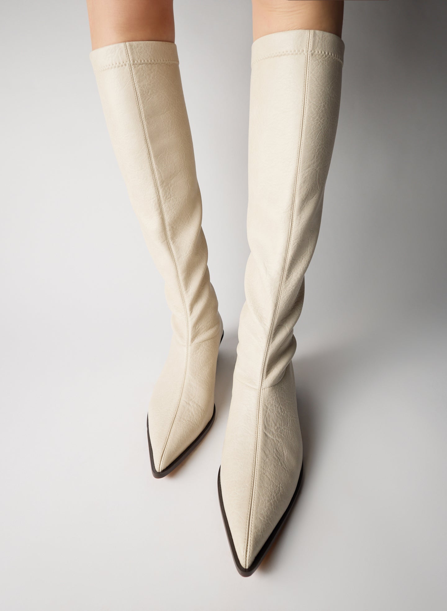 Off White Faux Leather Bronson Boot - tall, pointed toe boot - on model