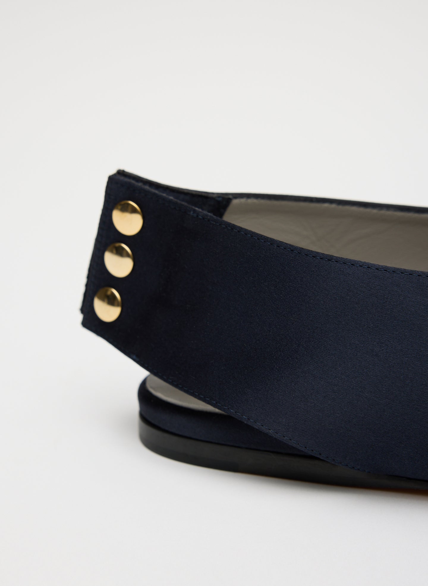 Navy Norbert Satin Flat - closeup of hardware detail at back
