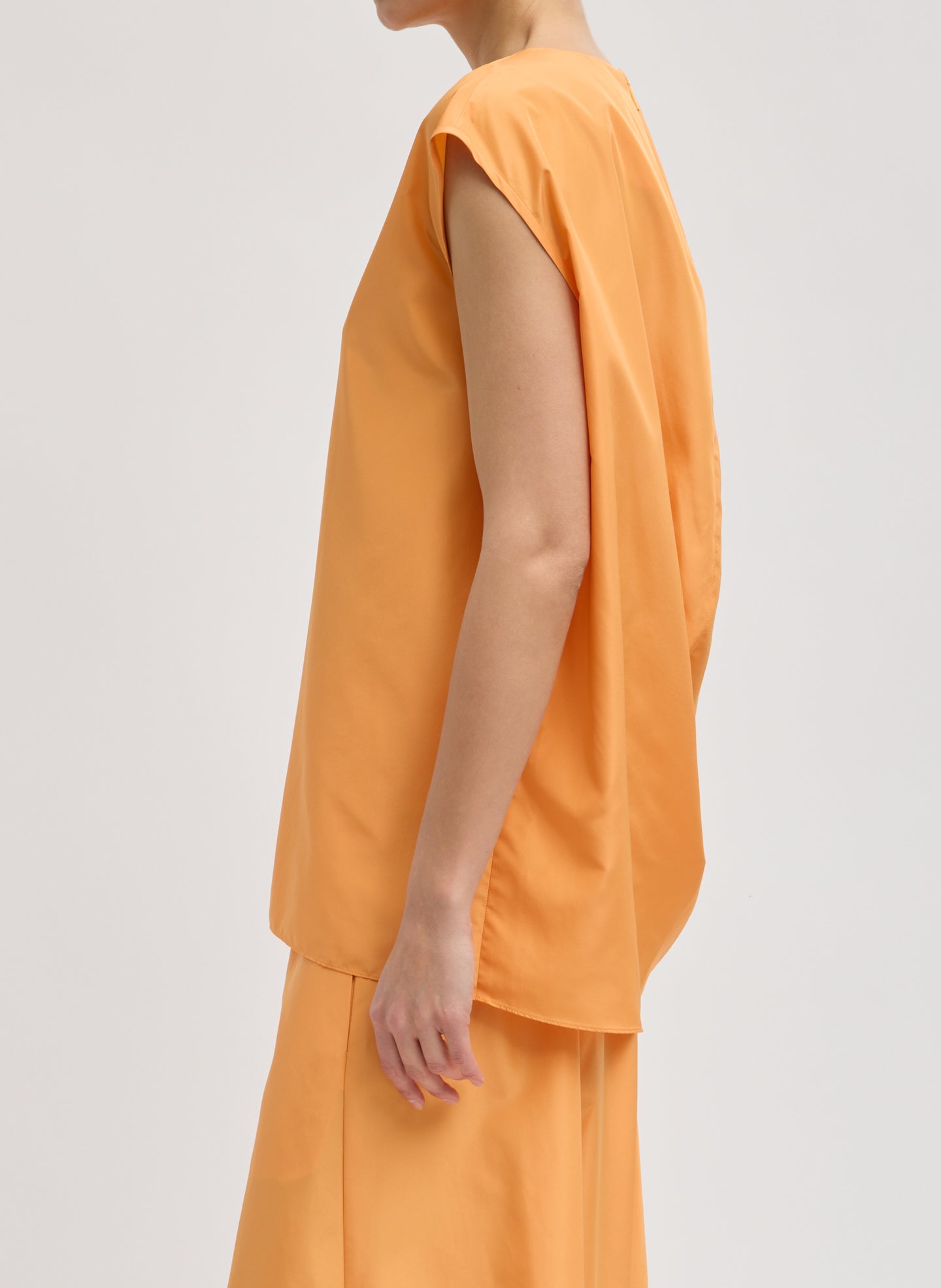 Orange Summer Nylon Sleeveless Cocoon Top - side view on model