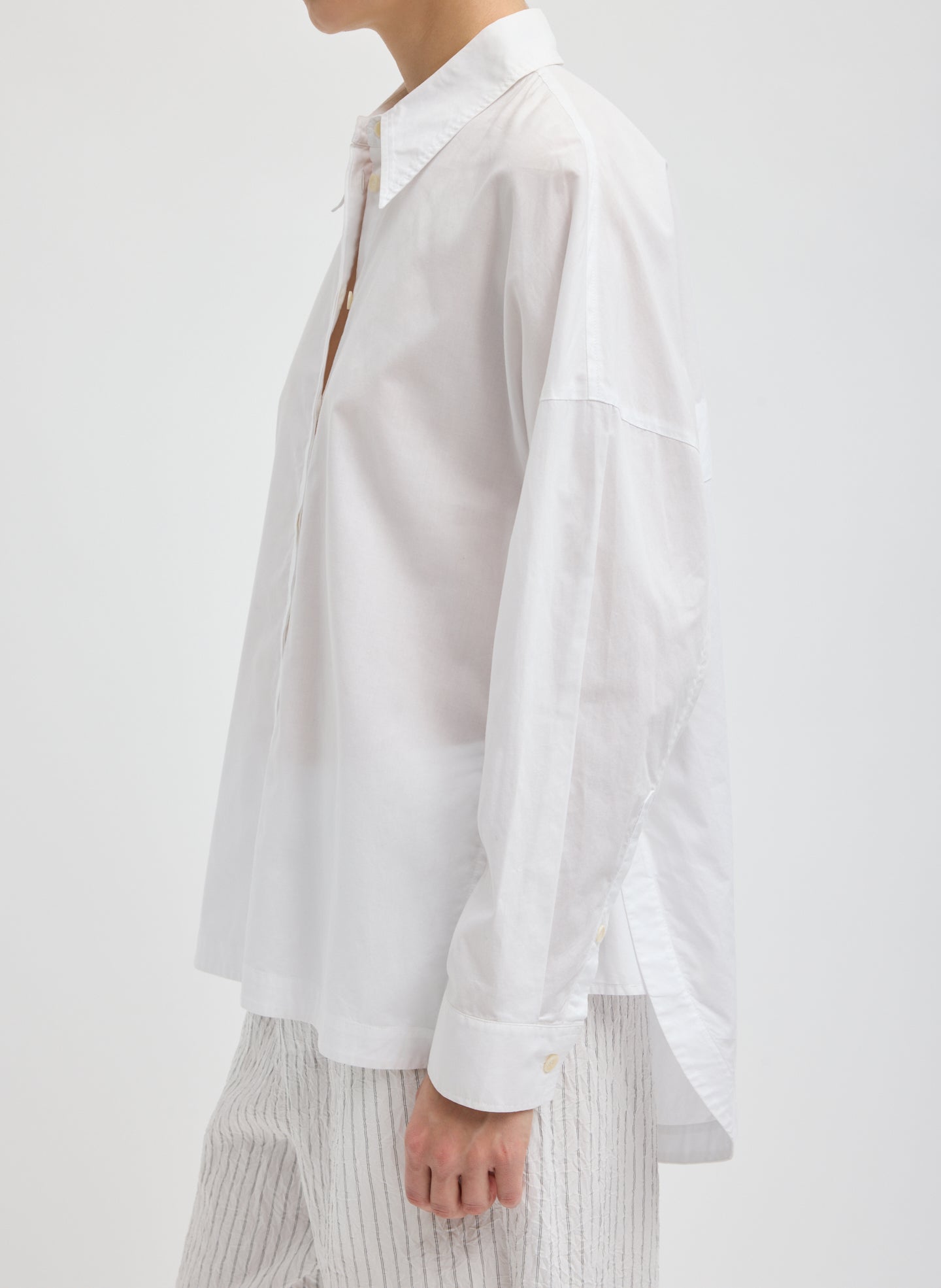 White Gabe Oversized Shirt - oversized button down, side view on model