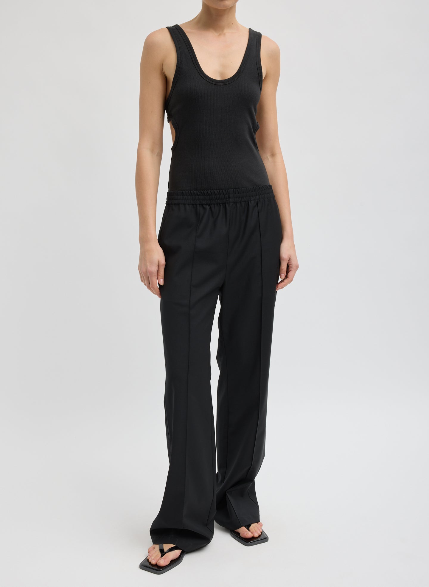 Black Tropical Wool Scottie Jogger - pull on trousers, front view on model
