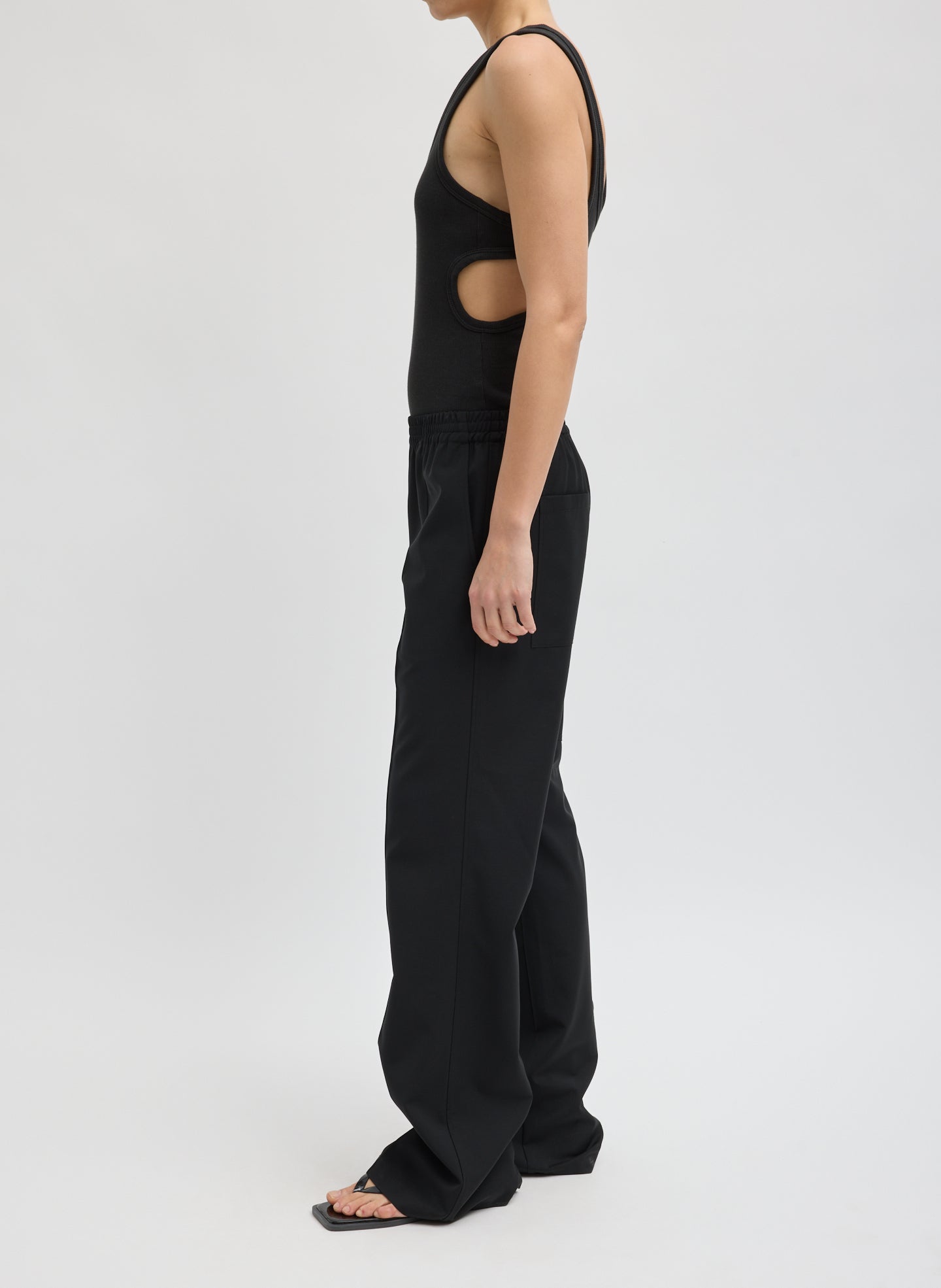 Black Tropical Wool Scottie Jogger - pull on trousers, side view on model