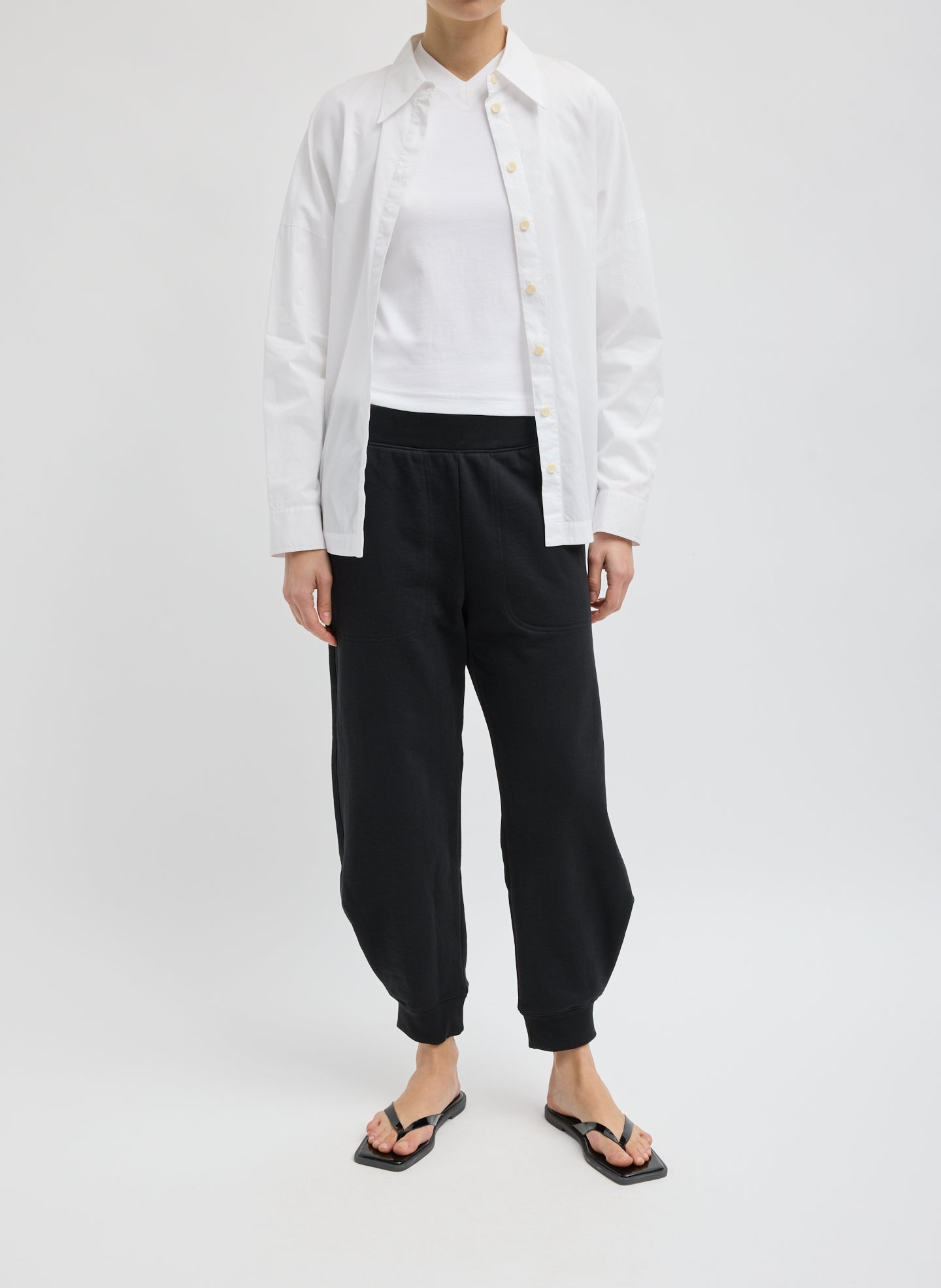 Calder Sweatpant - Black Calder Sweatpant - barrel leg sweatpant, front view on model