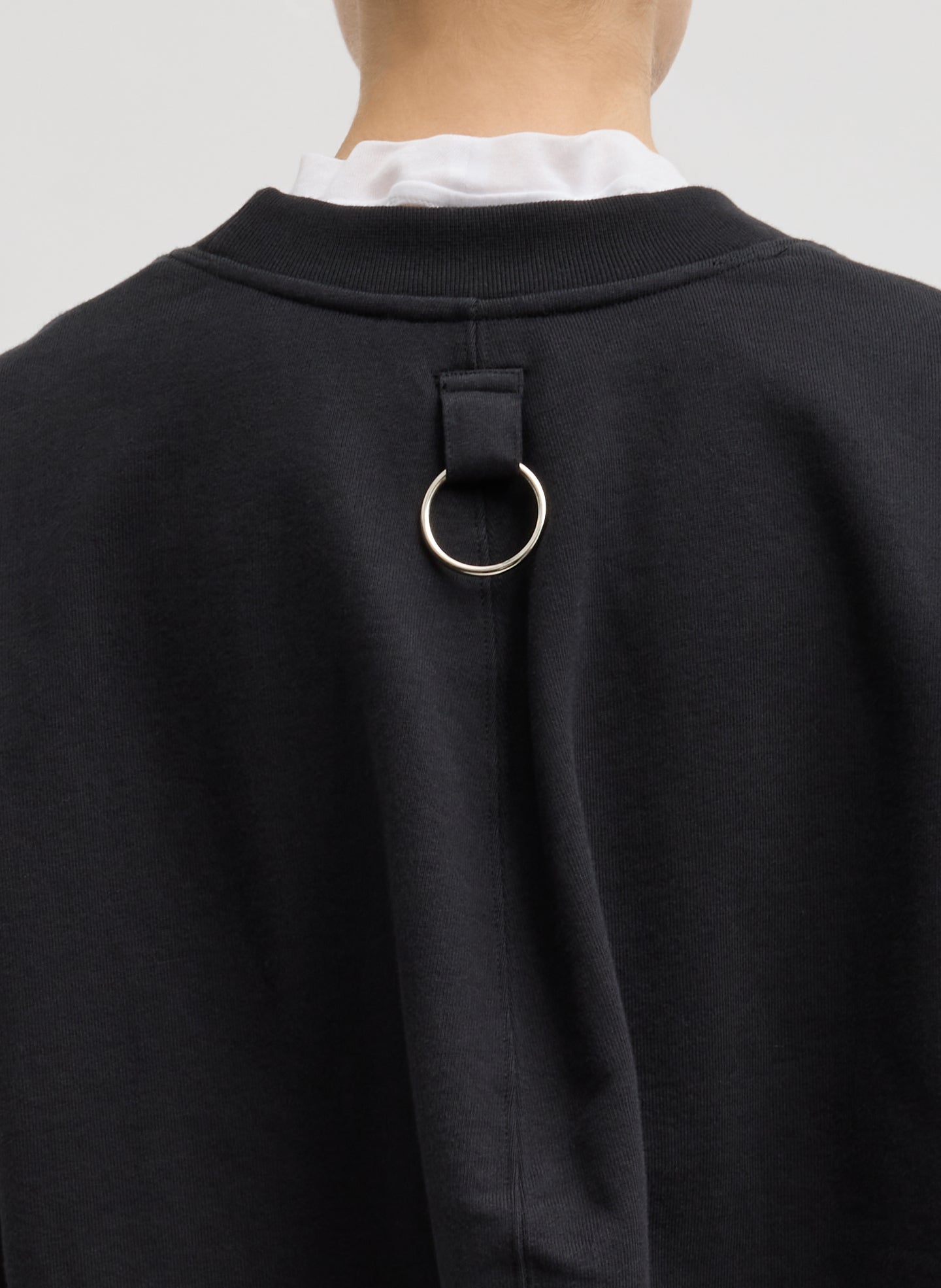 Black Cocoon Crewneck Sweatshirt - closeup of ring detail at back