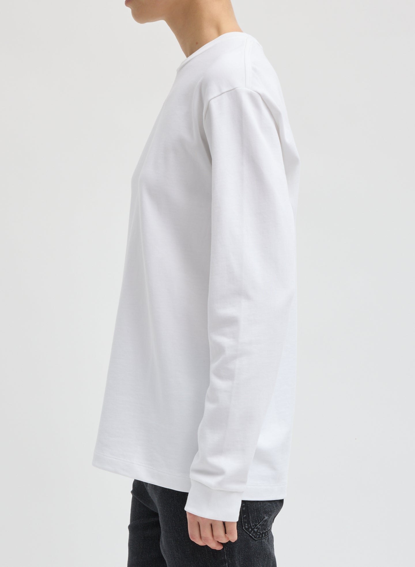 White Perfect Unisex Long Sleeve T-Shirt - side view on model