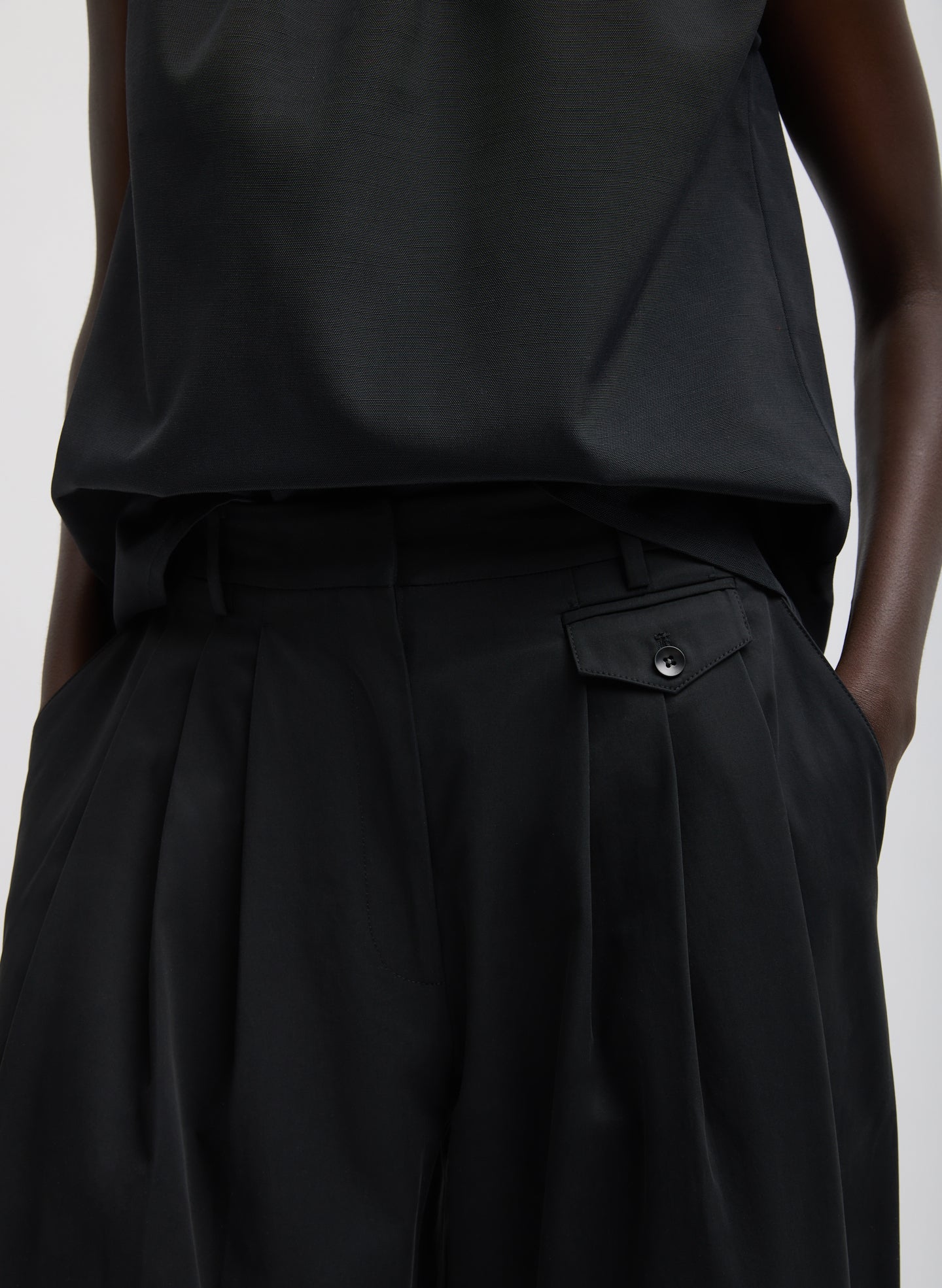 Black Bio Twill Triple Pleat Pant - closeup of front pocket and pleating detail