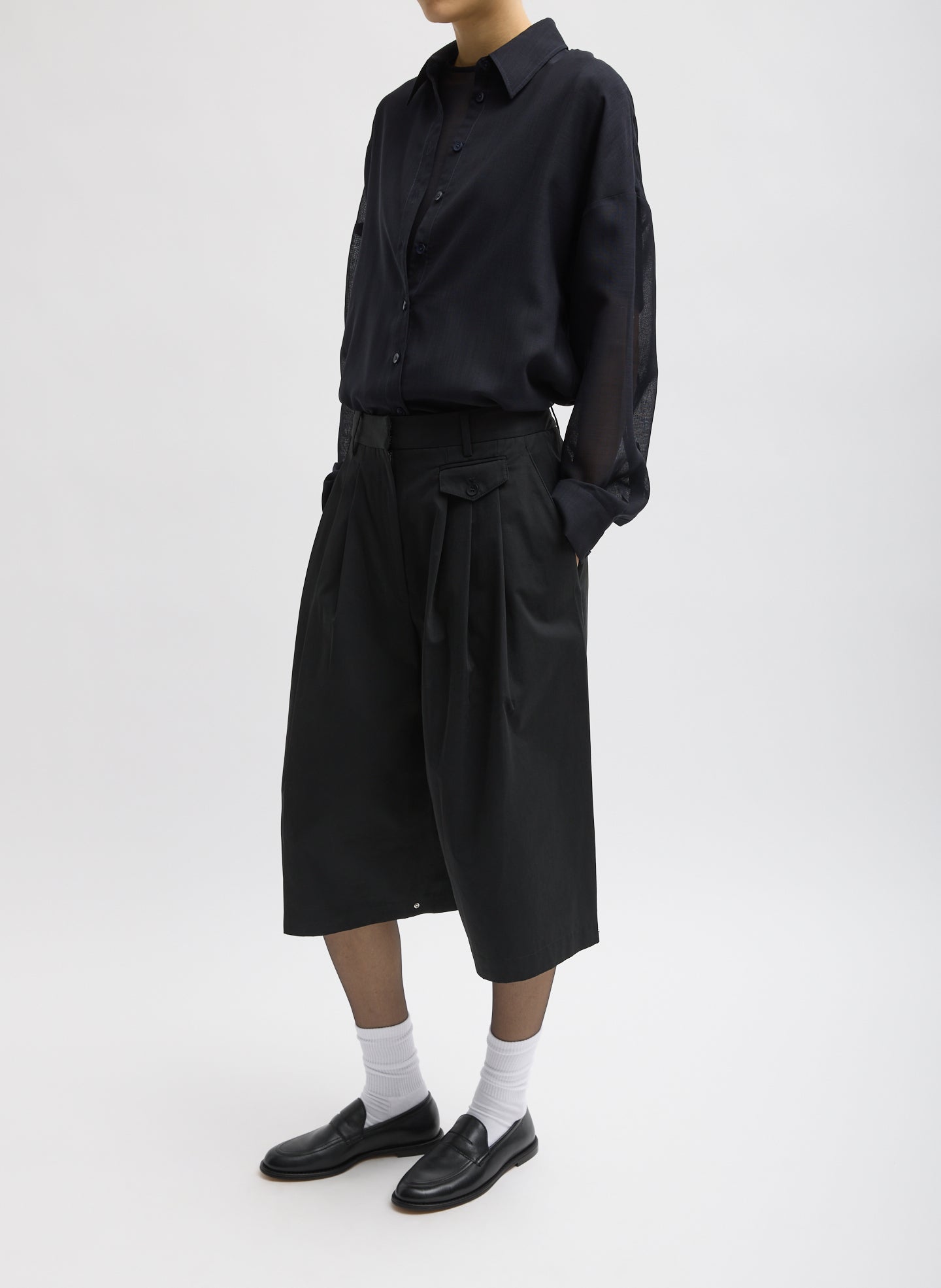 Black Bio Twill Triple Pleat Short - full look, three-quarter view on model